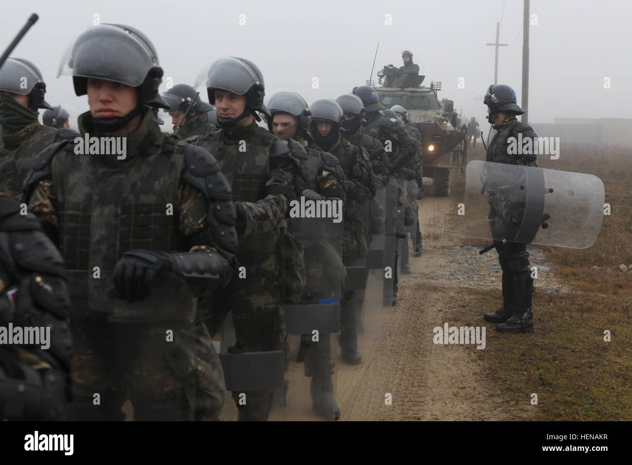 Slovenian soldiers prepare to conduct riot control operations during ...