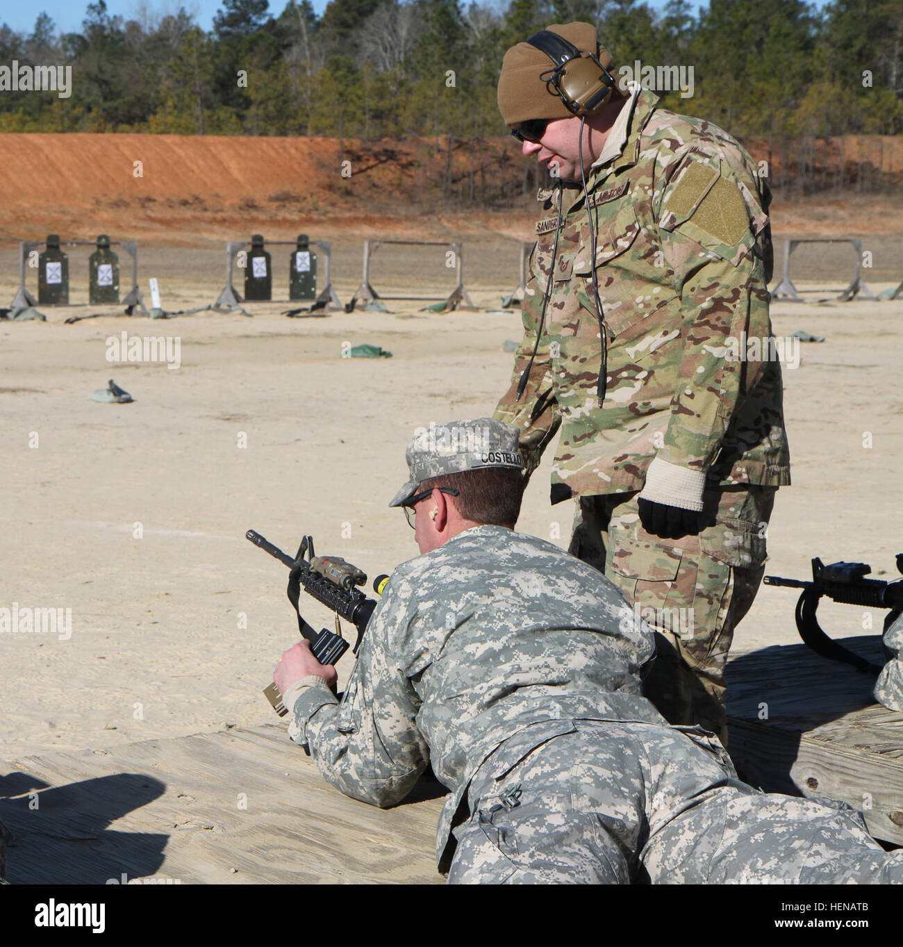 140122-A-BZ612-6133: Air Force Tech. Sgt. Sanderson, a combat controller assigned to 17th Special Tactics Squadron and Pvt. Teagon Costello, an infantryman and native of Boston preform a safety check before Teagon fires, during a joint training exercise with the Air Froce, at Fort Benning, Jan. 22. 1st Bat.15th Inf Regiment, 3rd ABCTeam SCAR training with CCT Stock Photo