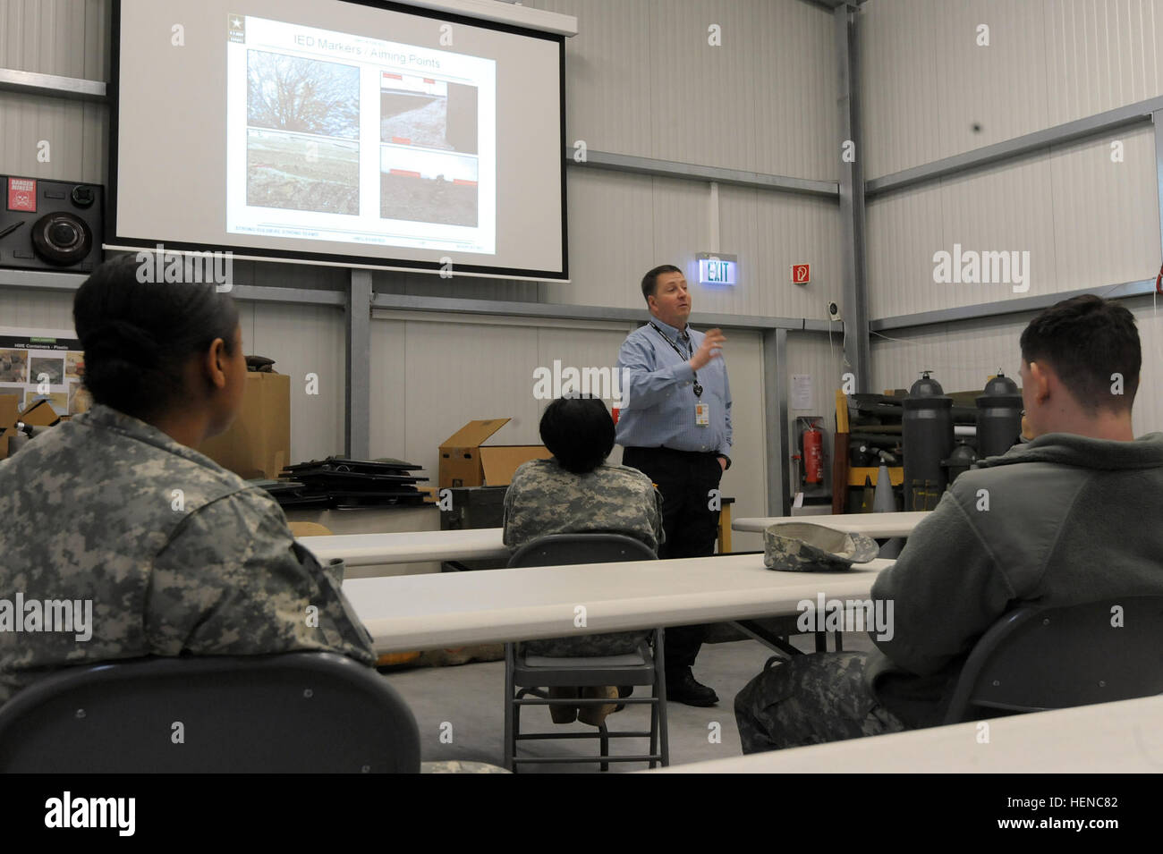 U.S. Army soldiers, assigned to Alpha Detachment, 106th Finance Company, 18th Combat Sustainment Support Battalion, attend an Improvised Explosive Device (IED) Awareness Class at the Training Support Activity Europe's Counter IED Integration Cell Classroom at the 7th Army Joint Multinational Training Command's Grafenwoehr Training Area, Germany, Feb. 27, 2014. (U.S. Army photo by Visual Information Specialist Gertrud Zach/released) Improvised Explosive Device (IED) Awareness Class, Grafenwoehr Germany 140227-A-HE359-048 Stock Photo