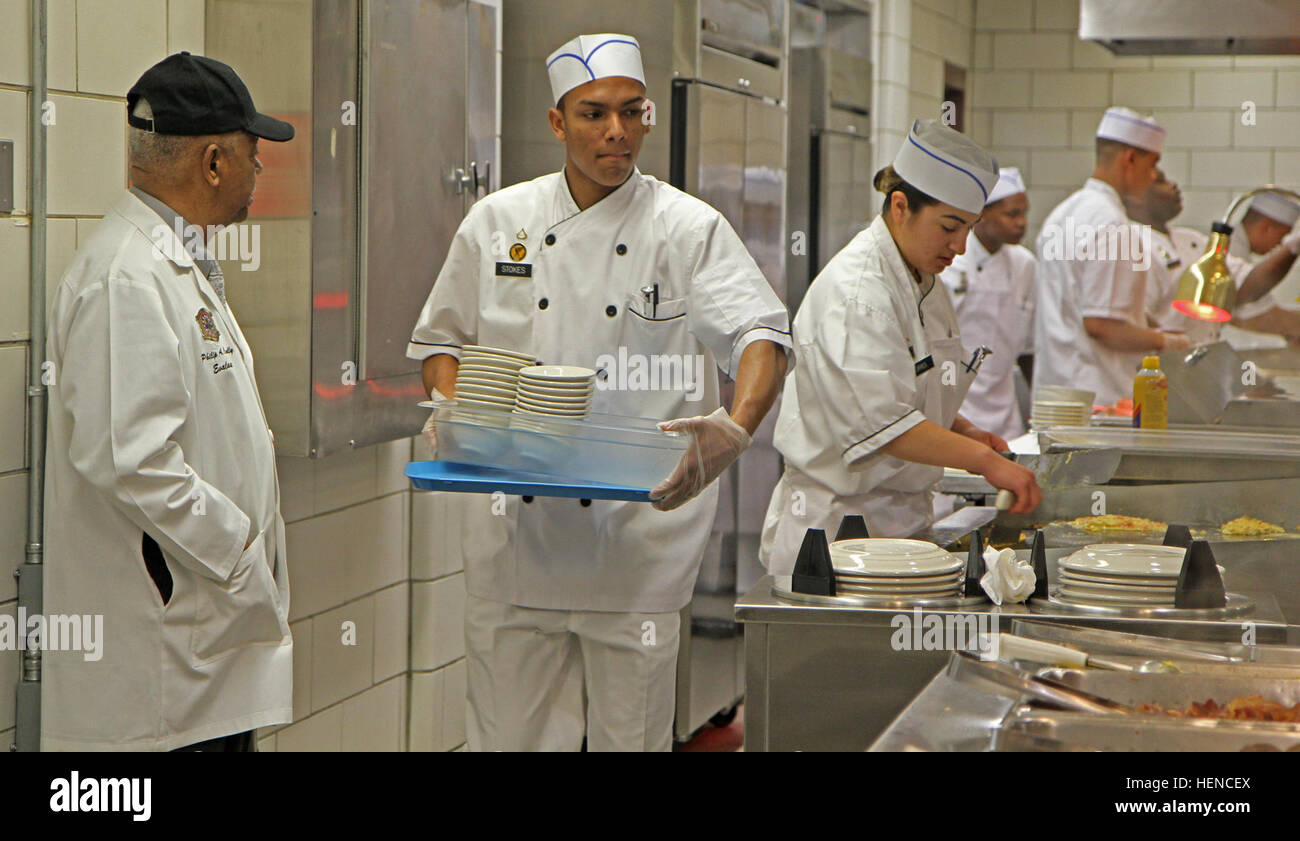 James Riddle, an evaluator with the U.S. Army Food Service, observes ...