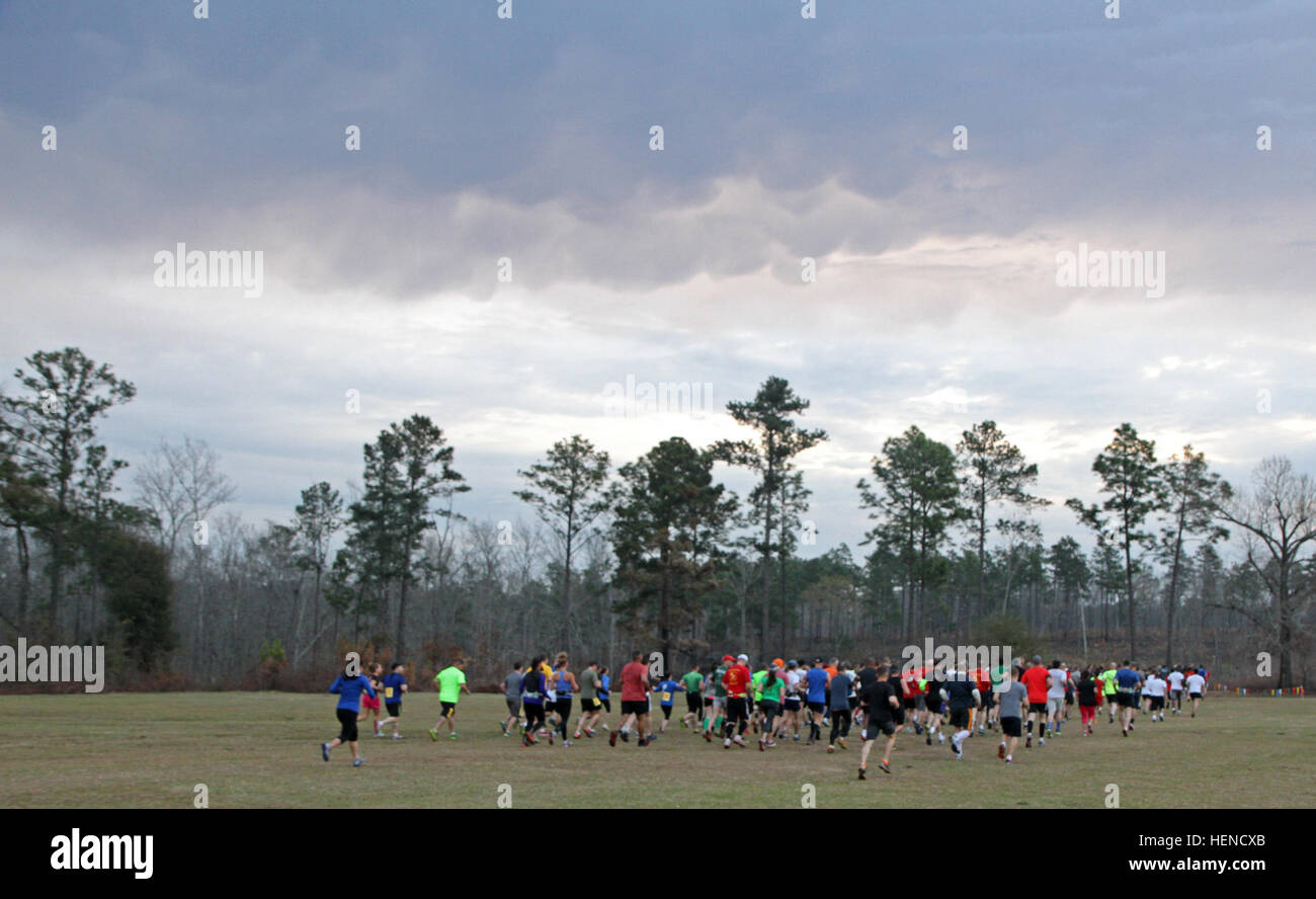 More than 200 racers start the 2014 Chesty Puller 13.1 Trail Race, March 15, at Fort Benning's Dickman Field on Kelley Hill. The half marathon featured hills, rotted woods, swamp lands, gravel and dirt roads. Half-marathon trail race 'not for the faint of heart' 140315-A-IP604-323 Stock Photo