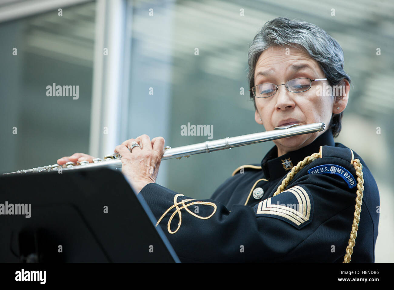 Master Sgt. Marie Luisa de la Cerda Rohde plays, 'SYRINX for unaccompanied flute,' by Claude Debussy during a chamber music concert with other female members of The United States Army Band 'Pershing's Own,' in honor of Women's History Month at The Women in Military Service for America Memorial in Arlington, Va. March 22, 2014. The concert featured female members of 'Pershing's Own.' (Joint Base Myer-Henderson Hall PAO photo by Rachel Larue) Women musicians perform in honor of Women%%%%%%%%E2%%%%%%%%80%%%%%%%%99s History Month 140320-A-DQ287-708 Stock Photo
