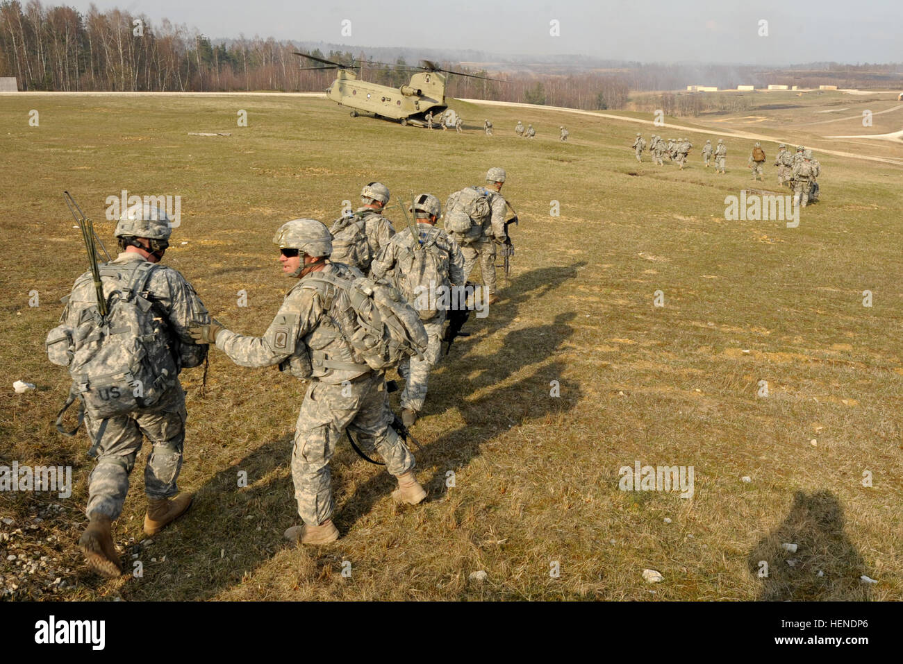 U.S. Army paratroopers, assigned to 1st Battalion, 503rd Infantry Regiment, 173rd Infantry Brigade Combat Team (Airborne), board a CH-47 Chinook during a combined-arms live-fire exercise on March 28, 2014. Grafenwoehr and Hohenfels Training Areas in order to prepare the 12th Combat Aviation Brigade to deploy to Afghanistan to provide medical evacuation and combat support to the NATO International Security Assistance Force mission. (U.S. Army photo by Gertrud Zach/released) CALFEX at JMTC Grafenwoehr, Germany 140328-A-HE539-0388 Stock Photo