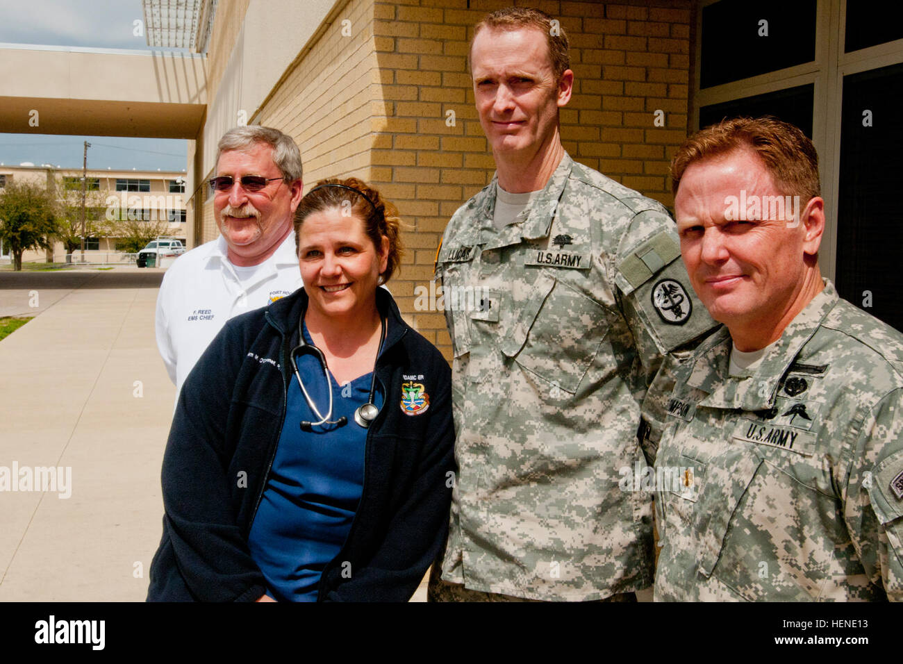 From left: Frederick Reed, Fort Hood Emergency Medical Services chief; Dawn O'Connell, Carl R. Darnall Army Medical Center triage and charge nurse; Lt. Col. (Dr.) James Lucas, Carl R. Darnell chief of the Department of Surgery; and Maj. (Dr.) Michael Simpson, Carl R. Darnell ER officer-in-charge, stand next to the emergency bay in which ambulances delivered the casualties from the April 2 shooting on Fort Hood. All four pictured here and their teams treated every casualty hurt in the incident, in many cases saving lives with only minutes to spare. Four people were killed and 16 injured in the  Stock Photo