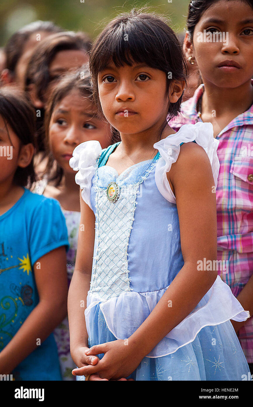 Guatemalan children gather for an opening ceremony as U.S. Soldiers, Airmen, and Guatemalan soldiers break ground to construct a new school during Beyond the Horizon 2014, Zacapa, Guatemala, April 8, 2014. Beyond the Horizon is an annual exercise that embraces the partnership between the United States and Guatemala, to provide focused humanitarian assistance through various medical, dental, and civic action programs. (U.S. Army photo by Staff Sgt. Justin P. Morelli) Beyond the Horizon 2014, Guatemala 140408-A-PP104-002 Stock Photo