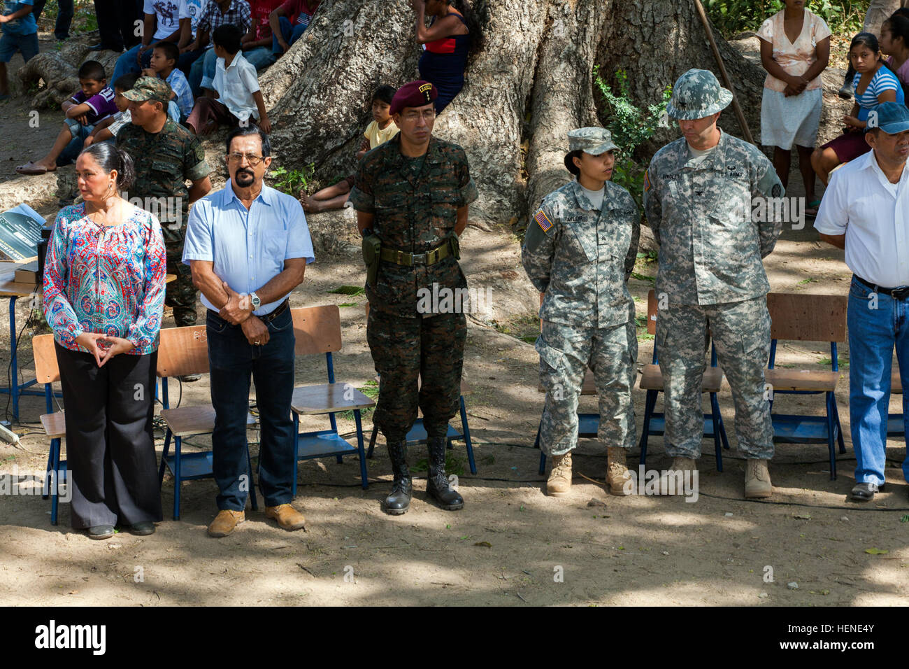 Distinguished guests await the start of an opening ceremony as U.S. Army and Guatemalan Soldiers break ground to construct a new school during Beyond the Horizon 2014, Zacapa, Guatemala, Apr. 9, 2014. Beyond the Horizon is an annual exercise that embraces the partnership between the United States and Guatemala, to provide focused humanitarian assistance through various medical, dental, and civic action programs. (U.S. Army photo by Staff Sgt. Justin P. Morelli) (Not Released) Beyond the Horizon 2014 140409-A-PP104-023 Stock Photo