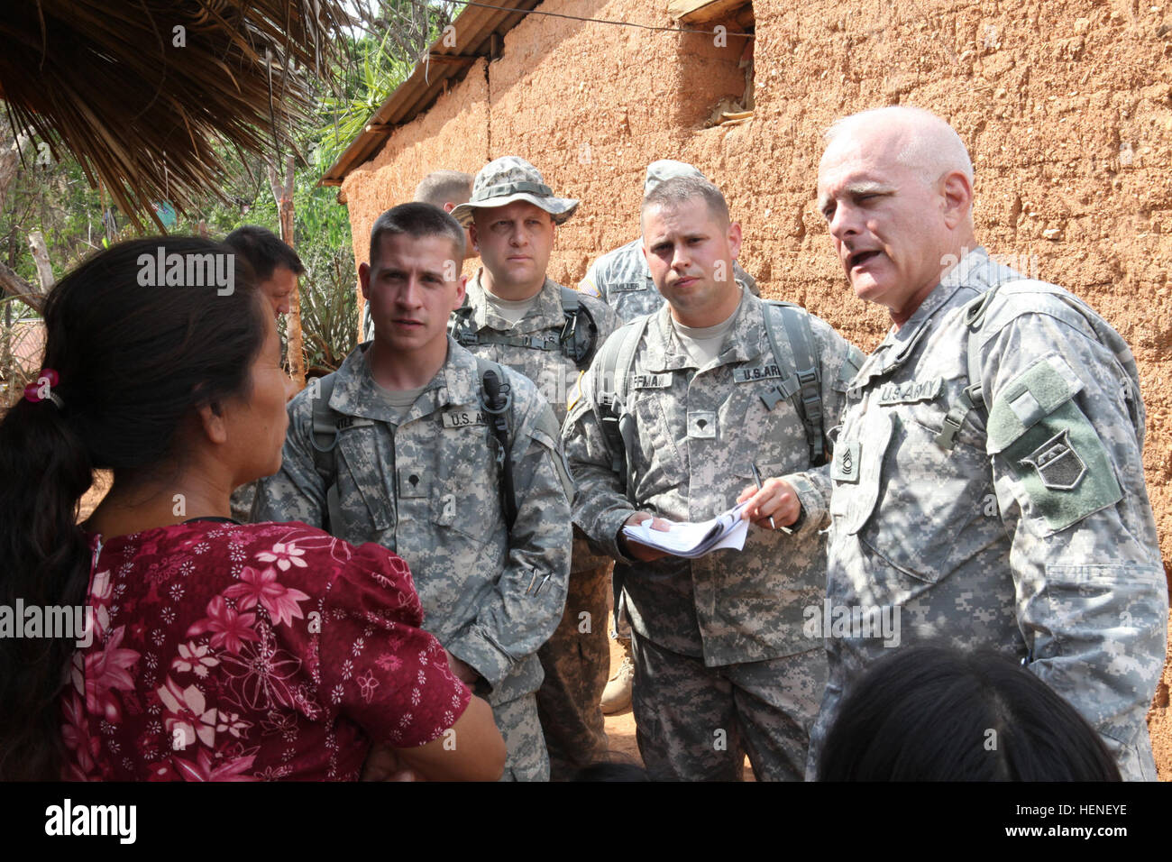 US Soldiers assigned to the 318th PsyOp Company, discusses with a local Guatemalan woman about a school building project  by US forces during Beyond the Horizon 2014, El Roble Concaste, Guatemala, Apr. 23, 2014. Beyond the Horizon is an annual exercise that embraces the partnership between the United States and Guatemala, to provide focused humanitarian assistance through various medical, dental, and civic action programs. (U.S. Army photo by Spc. Gary Silverman)(Released) Beyond the Horizon 2014, Guatemala 140423-A-TO648-056 Stock Photo