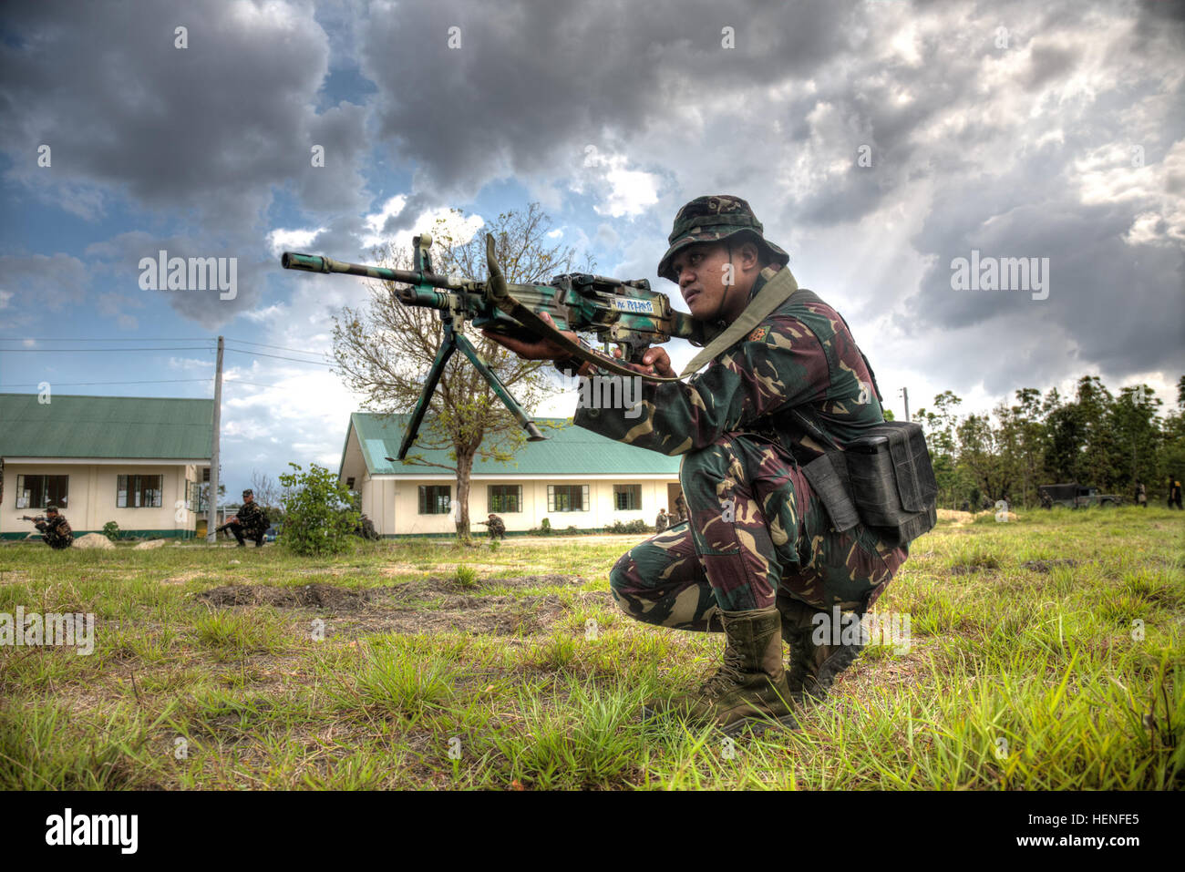 Philippine Army soldier Pfc. Perante, 20th Infantry Battalion, Philippine Army, how to identify an improvised explosive device during exercise Balikatan 2014 on Fort Magsaysay, Philippines, May 01, 2014. The Soldiers are trained to form a three-hundred sixty degree perimeter away from an unexploded ordnance. This year marks the 30th iteration of the exercise, which is an annual Republic of the Philippines-U.S. military bilateral training exercise and humanitarian civic assistance engagement.  (U.S. Army Photo by Spc. Michael G. Herrero) Balikatan 2014 140501-A-IR245-119 Stock Photo