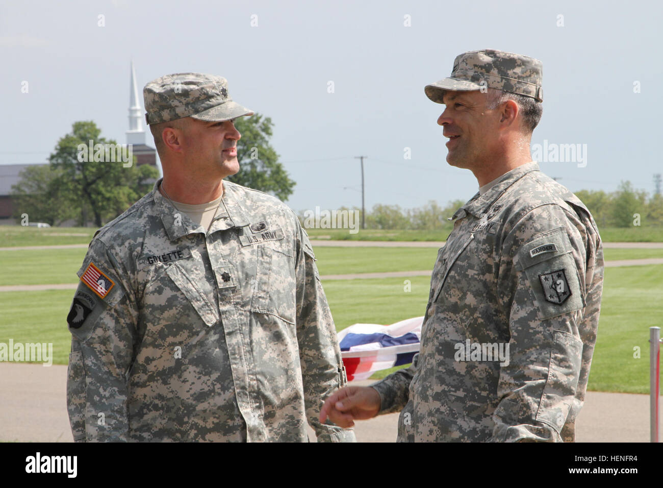 Lt. Col. Chad D. Goyette shares a few words with Col. James F. Reckard III, 4th Maneuver Enhancement Brigade commander, after Goyette officially assumed command of the 92nd Military Police Battalion, 4th MEB, 1st Infantry Division, May 7, 2014. (Photo by U.S. Army Sgt. Kelly S. Malone) Soldier left a private, returned a commander 140507-A-KX047-003 Stock Photo