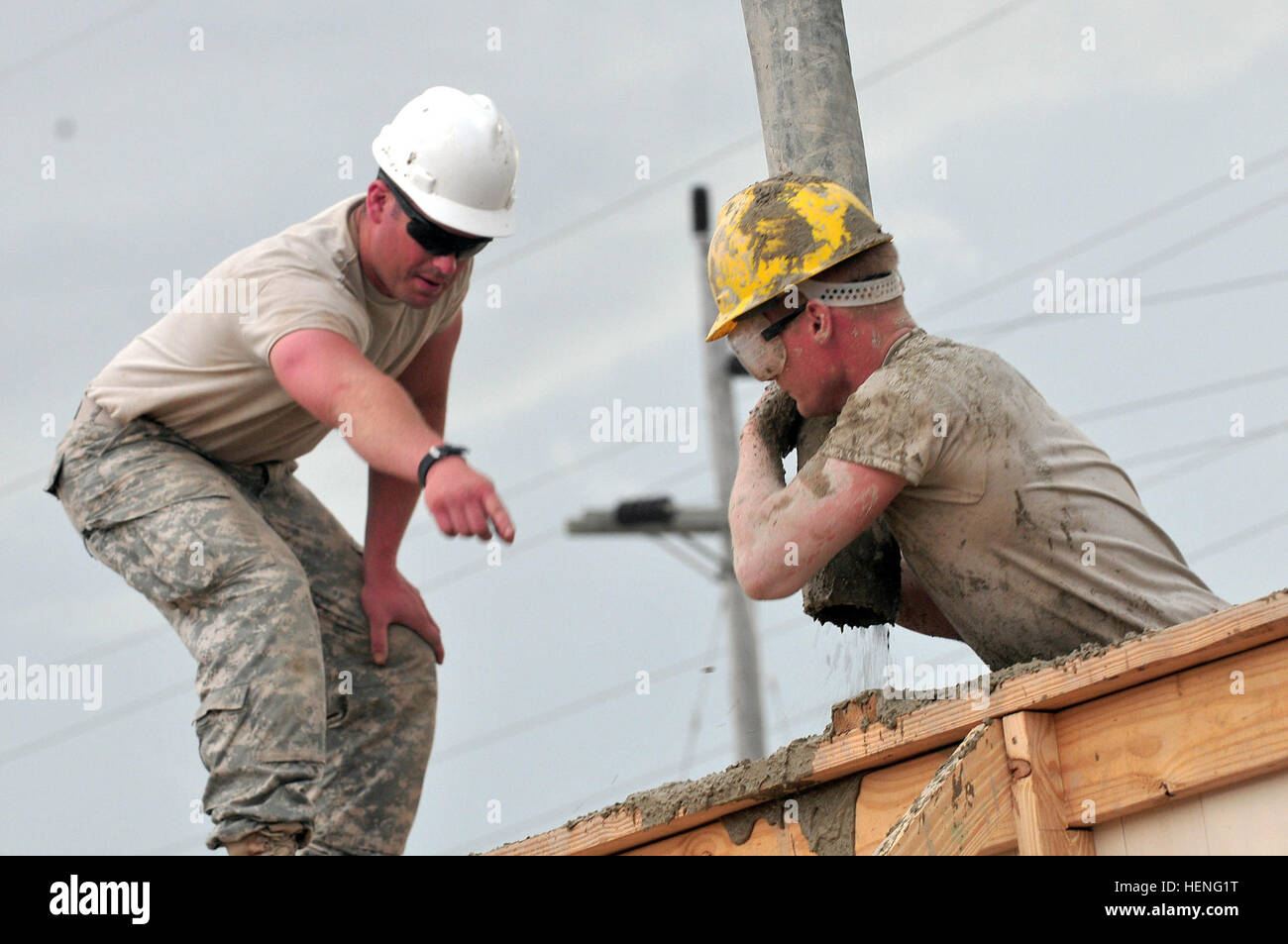 Soldiers of the Army Reserve 322nd and 389th Engineer Companies are currently assigned to Task Force Larimar and are supporting the United States Army South in the humanitarian and civic assistance mission Beyond the Horizon 2014 at Barahona, Dominican Republic. The service members are working in the construction of three medical clinics and two schools as part of their annual training exercise. (National Guard photo by Staff Sgt. Joseph Rivera Rebolledo, 113th Mobile Public Affairs Detachment, Task Force Larimar Public Affairs) Building is what we do; Army Engineers Build Schools, Medical Cli Stock Photo