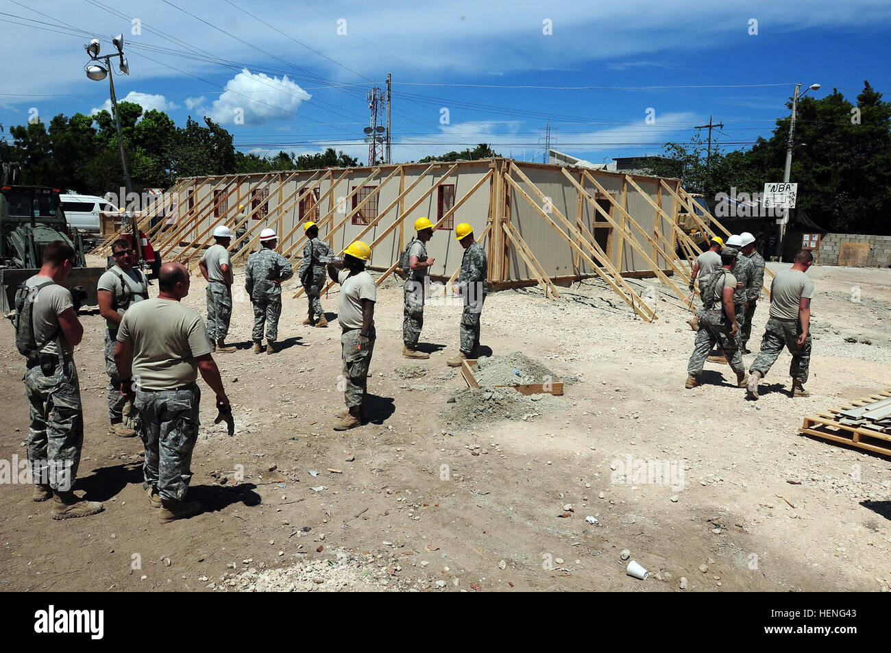 Soldiers of the Army Reserve 322nd and 389th Engineer Companies are currently assigned to Task Force Larimar and are supporting the United States Army South in the humanitarian and civic assistance mission Beyond the Horizon 2014 at Barahona, Dominican Republic. The service members are working in the construction of three medical clinics and two schools as part of their annual training exercise. (National Guard photo by Staff Sgt. Joseph Rivera Rebolledo, 113th Mobile Public Affairs Detachment, Task Force Larimar Public Affairs) Building is what we do; Army Engineers Build Schools, Medical Cli Stock Photo