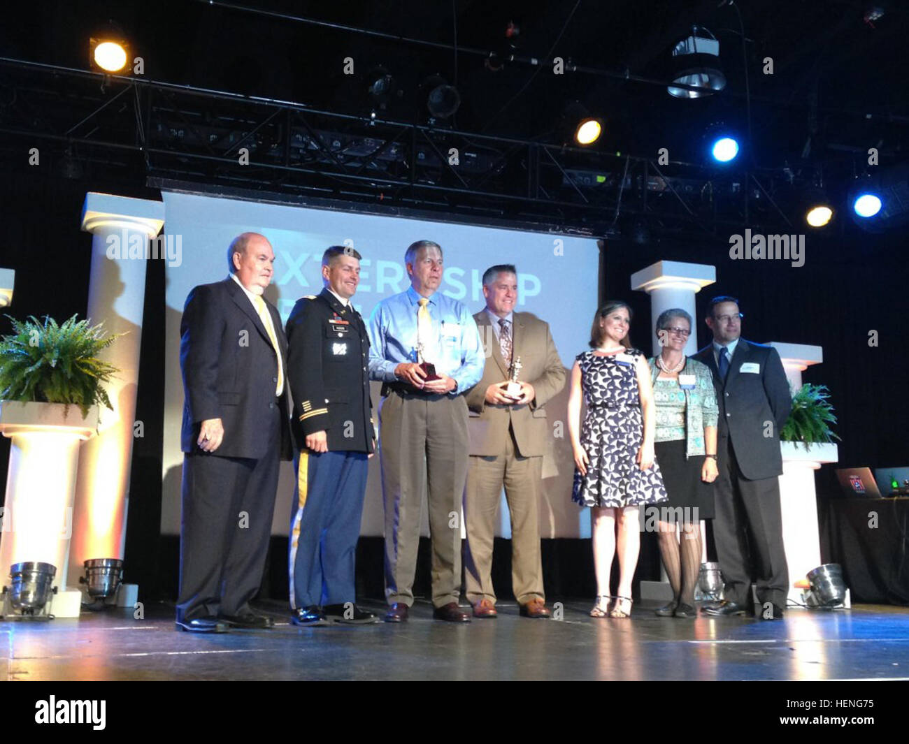 (Left to right) J. D. Elliott, president of the Memorial Foundation; Lt. Col. John L. Hudson, U.S. Army Corps of Engineers Nashville District commander; Bob Sneed, Nashville District Water Management Section chief; Michael Steele, executive principal at Stratford STEM Magnet High School; Jennifer Berry, academy coach at Stratford; Janet Wallace, associate principal at Stratford; and Jeff Davis, associate principal at Stratford; pose during the Externship of the Year Award  presentation at the 2014 Academies of Nashville Awards hosted by the chamber of commerce May 12, 2014 at Rocketown in Nash Stock Photo