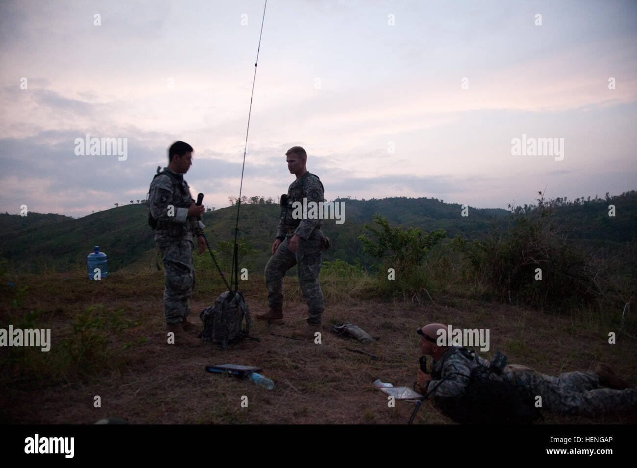 U.S. Army Capt. Gregory Hom, left, Capt. James Hahn, center, and Maj. Joseph Weinburg, right, from 3rd Squadron, 4th Cavalry regiment plan the opposition forces next move for the combined battalion attack training at Fort Magsaysay, Philippines during Balikatan 2014, May 15, 2014.  The battalion attack is a culminating exercise that tests the interoperability between the Armed Forces of the Philippines and U.S. Soldiers.  This year marks 30th iteration of the exercise, which is an annual Republic of the Philippines-U.S. military bilateral training engagement.  (U.S. Army photo by Sgt. 1st Clas Stock Photo