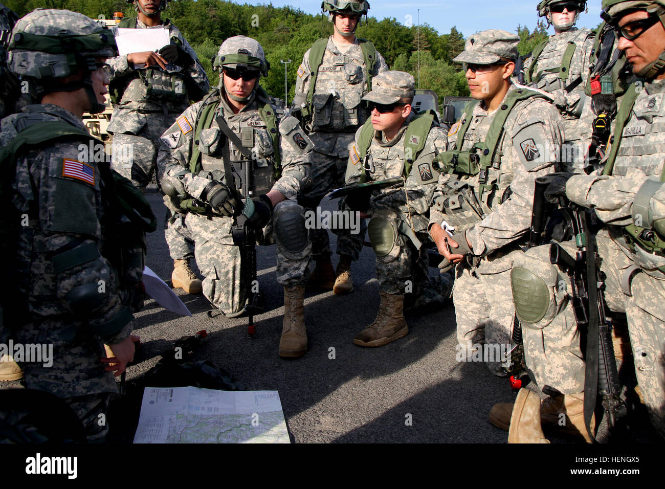 A convoy commander briefs her crew on route planning and security for a ...