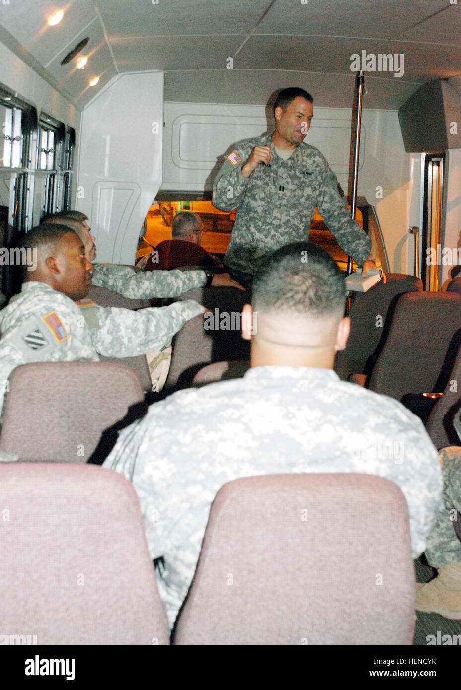 Army Chaplain (Capt.) Scott Brill dialogues with Troopers as they are transported into Camp Delta. 'Rap with the Cap' is a new weekly bus ministry designed to accommodate shift workers who may not attend church services.  JTF Guantanamo conducts safe and humane care and custody of detained enemy combatants. The JTF conducts interrogation operations to collect strategic intelligence in support of the Global War on Terror and supports law enforcement and war crimes investigations. JTF Guantanamo is committed to the safety and security of American service members and civilians working inside its  Stock Photo