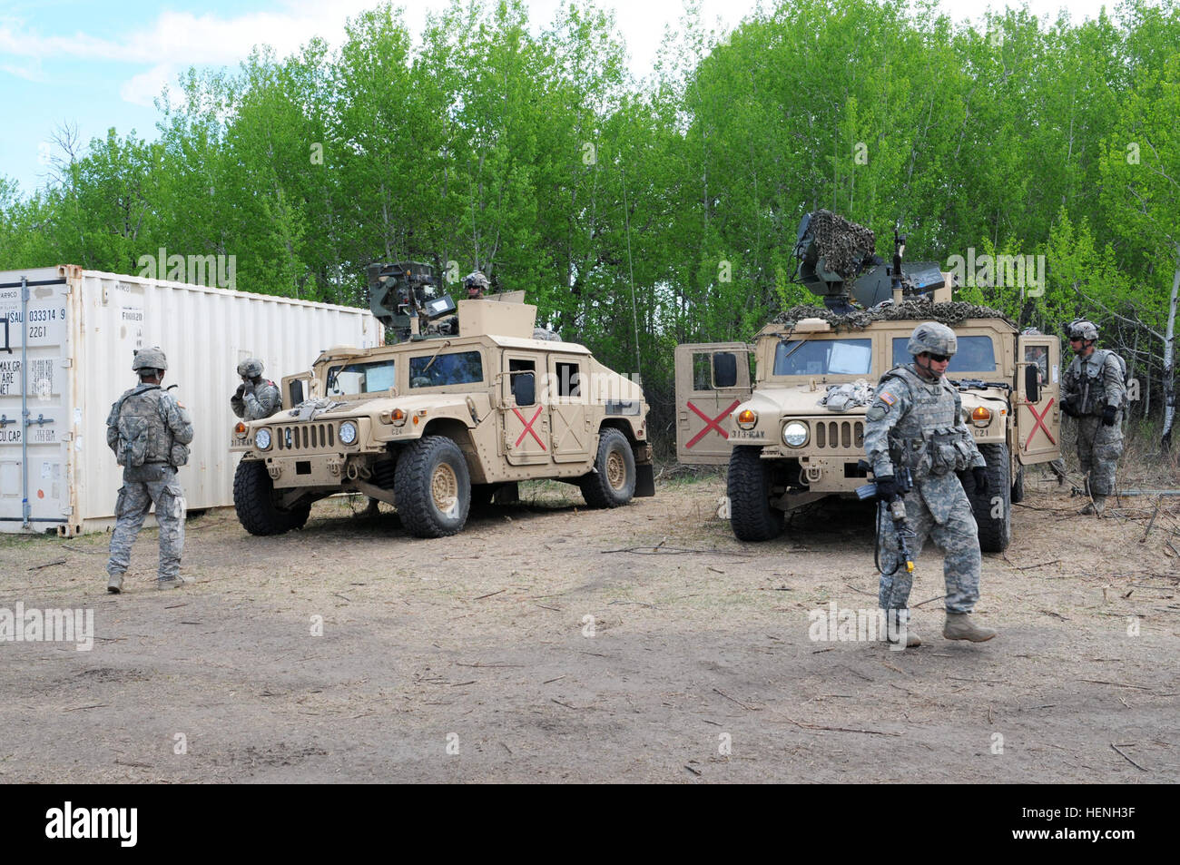 Soldiers of the 3rd Squadron, 1st Cavalry Regiment, 3rd Infantry Division out of Fort Benning, Ga., prepare to leave base camp during operations as the opposition force during Exercise Maple Resolve 2014 (EX MR14). Approximately 5,000 Canadian, British and U.S. troops participated in EX MR14, conducted here May 5-June 1. It is the culminating collective training event that validates the Canadian Army's High Readiness force for operations assigned to it by the Canadian government through the Chief of Defense Staff. 3rd ID troops augment OPFOR at Maple Resolve 14 140523-A-LG811-009 Stock Photo