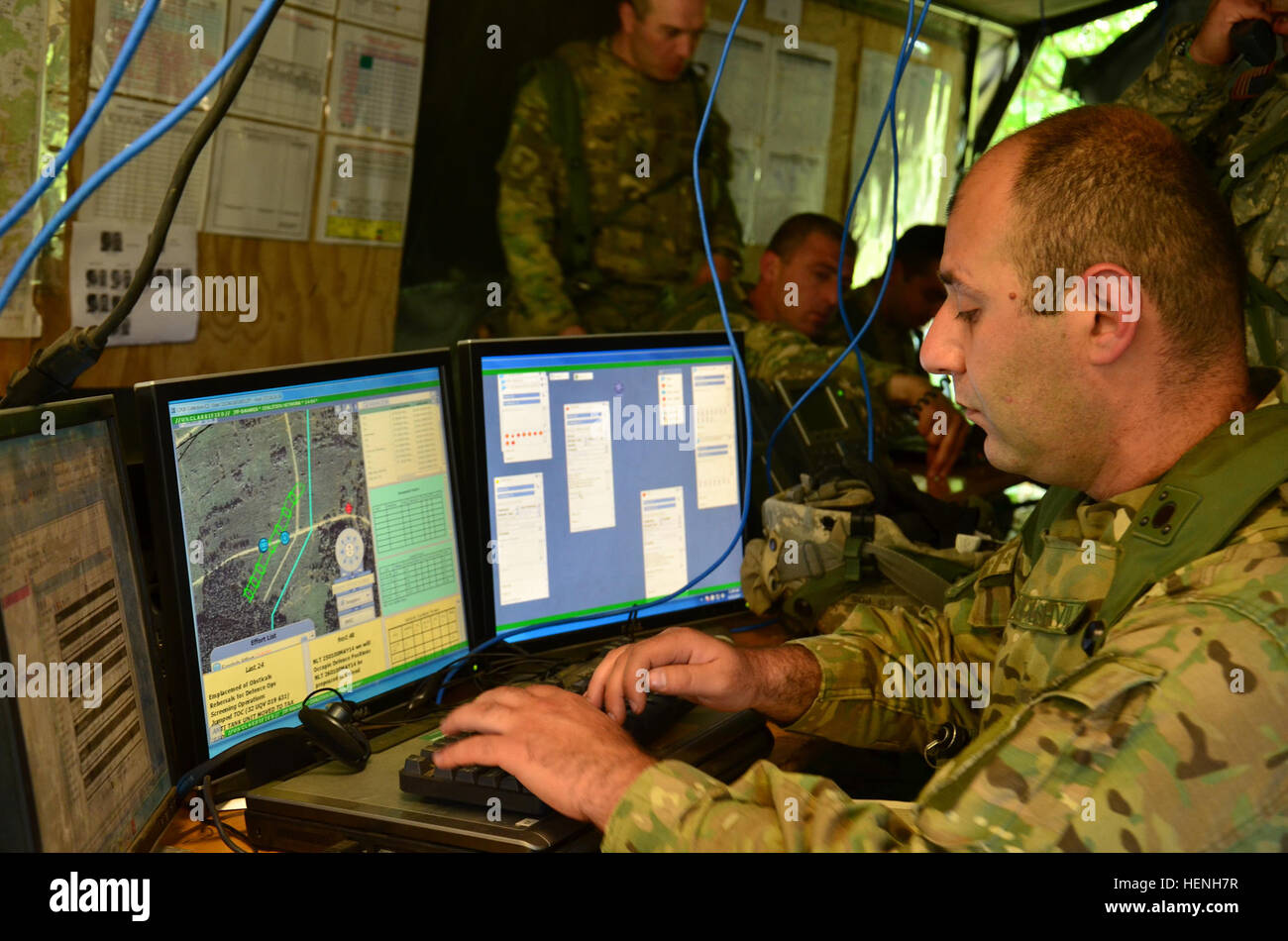 A Georgian soldier updates a digital map during exercise Combined Resolve II at the Joint Multinational Readiness Center in Hohenfels, Germany, May 25, 2014.  Combined Resolve II is a multinational decisive action training environment exercise occurring at the Joint Multinational Training Command's Hohenfels and Grafenwoehr Training Areas that involves more than 4,000 participants from 15 partner nations.  The intent of the exercise is to train and prepare a U.S. led multinational brigade to interoperate with multiple partner nations and execute unified land operations against a complex threat Stock Photo