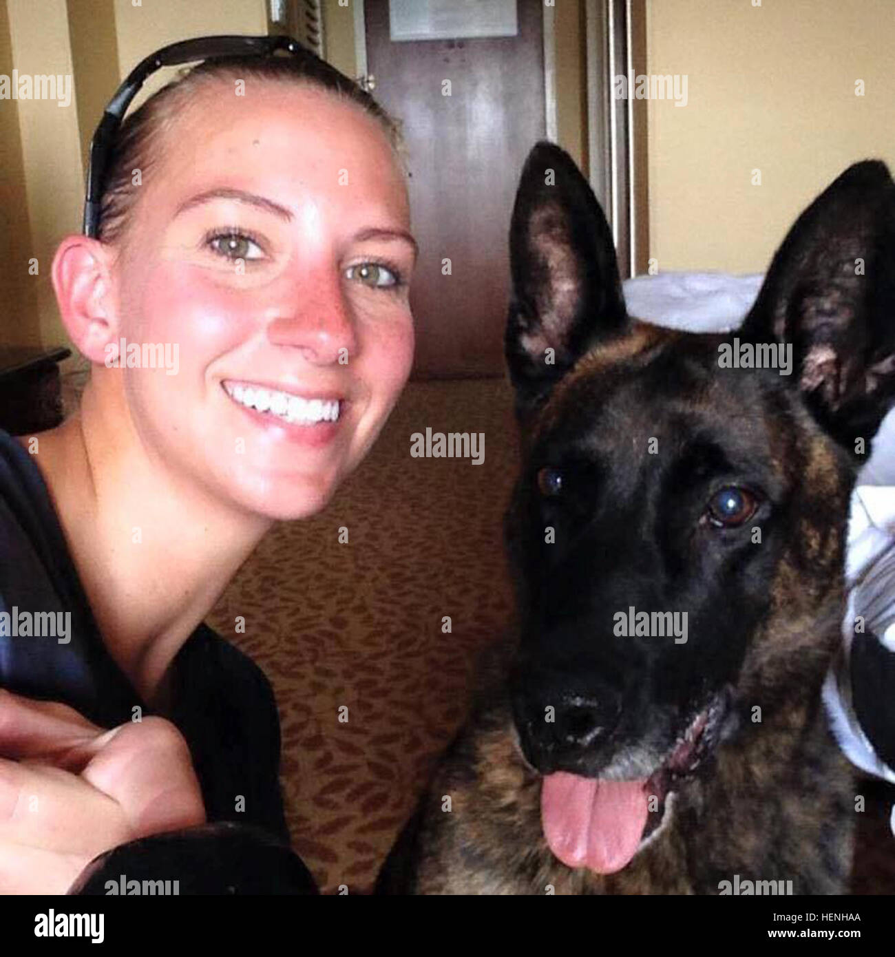 Patrol Explosive Detector Dog, Kobus and Sgt. Holly Moore, 550th Military Working Dog Detachment, 16th Military Police Brigade, take a selfie after a long day of explosive detection sweeps as part of a secret service mission when President Barack Obama spoke at the West Point graduation in New York, May 27, 2014. Moore and Kobus began their partnership in 2013 on Valentine’s Day, serving on many law enforcement missions and one deployment to Afghanistan before Kobus passed suddenly from cancer, March 11, 2015. Two years’ worth of long hours by one another’s sides forged a strong, selfless and  Stock Photo
