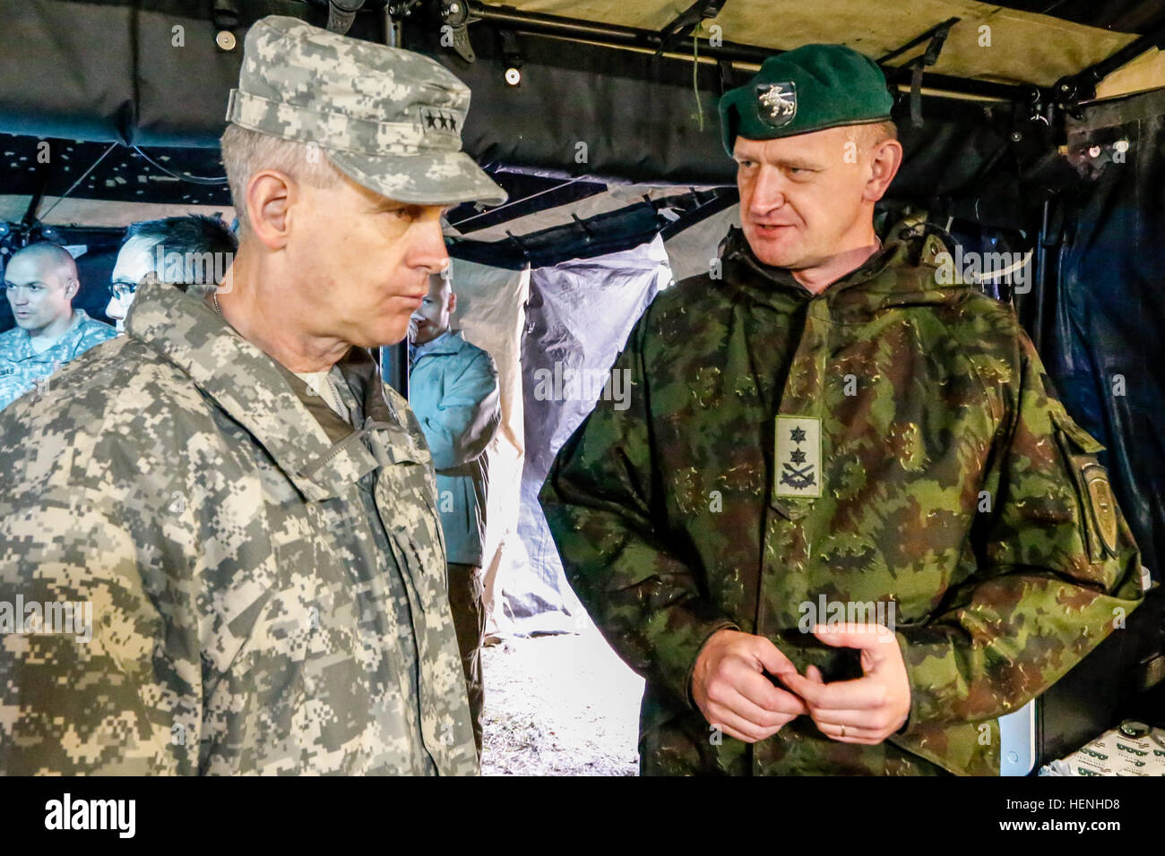 U.S. Army Lt. Gen. Donald M. Campbell, left, commanding general of U.S. Army Europe, and Lithuanian Maj. Gen. Leika Almantas, commander of the Lithuanian Land Force, discuss future plans during a visit of the Joint Multinational Readiness Center (JMRC) in Hohenfels, Germany, May 28, 2014.  Senior leaders visited the JMRC in order to observe training during Combined Resolve II, a multinational decisive action training environment exercise that involves more than 4,000 participants from 15 partner nations.  The intent of the exercise is to train and prepare a U.S. led multinational brigade to in Stock Photo