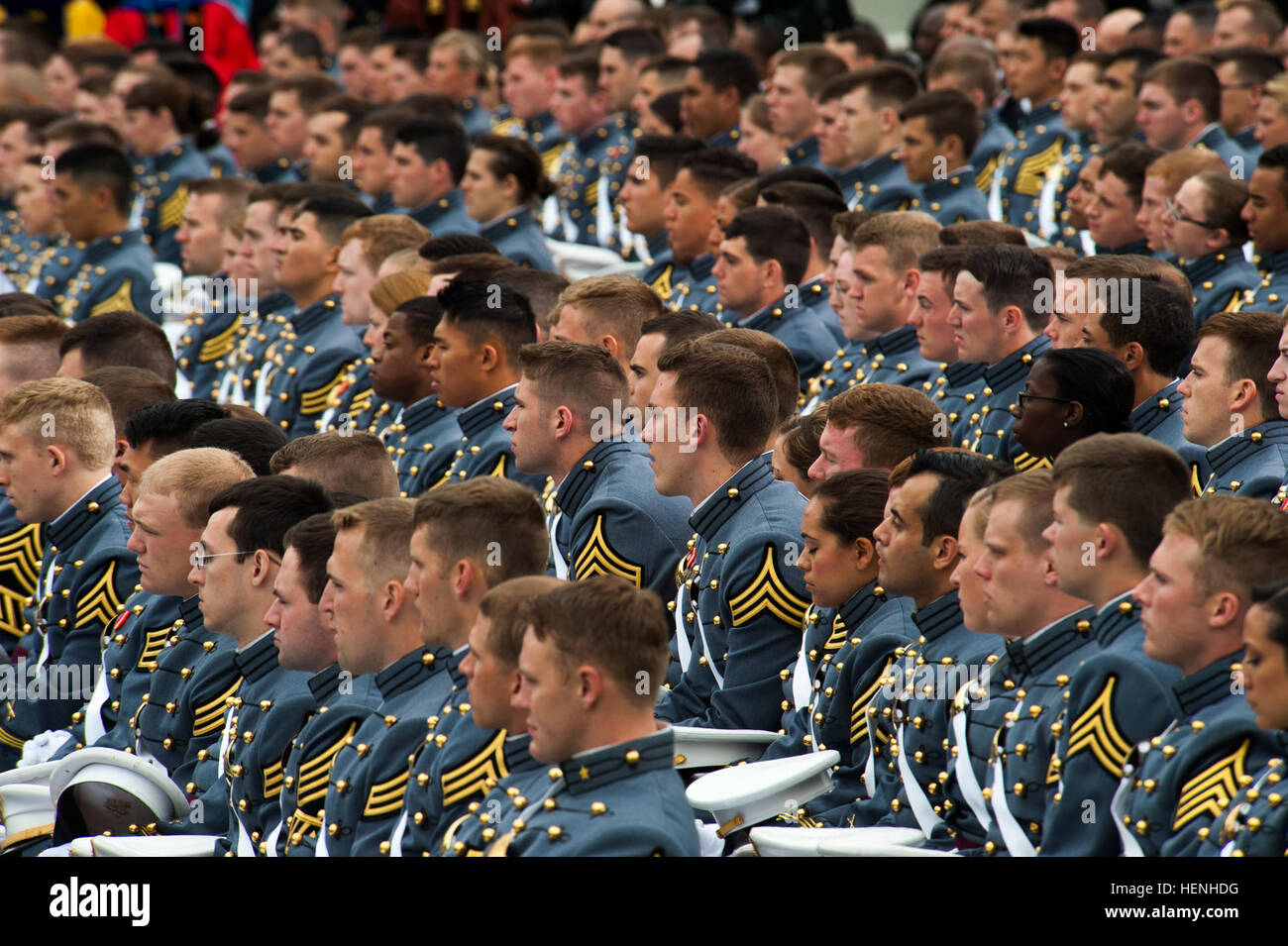 West Point Cadets from the graduating class of 2014 listen to President Barack H. Obama give his graduation address at Michie Stadium, West Point, N.Y., May 28, 2014. (U.S. Army photo by Sgt. Mikki L. Sprenkle/Released) 2014 West Point Graduation and Commissioning 140528-A-KH856-348 Stock Photo