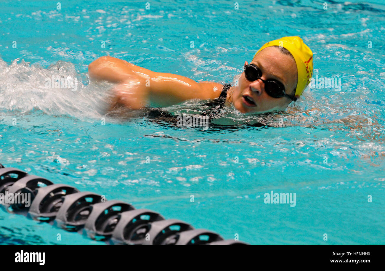 Katie Koch (far), Eastside Barracudas, pushes to swim faster to pass