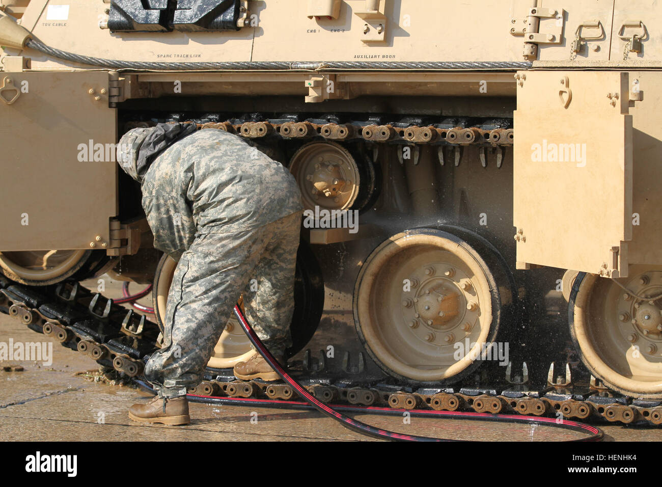 Soldiers from 2nd Battalion, 5th Cavalry Squadron, 1st Brigade Combat Team, 1st Cavalry Division, wash their M88 at the Hohenfels wash rack after completing the maneuver training portion of the multinational training exercise, Combined Resolve II. Clean the wheels 140602-A-SJ786-001 Stock Photo