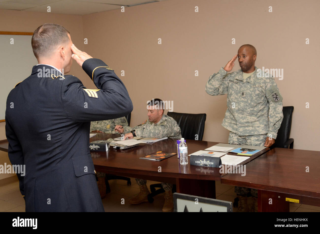 Army Sgt. Michael Sciandra (Left), 1st Battalion, 43rd Air Defense Artillery, salutes the president of a board, Command Sgt. Maj. Byron E. Ferguson, 11th Air Defense Artillery Brigade command sergeant major, during the 32nd Army Air and Missile Defense Command's Blackjack Warrior Competition leadership board at Fort Bliss, Texas, June 2. The 32d AAMDC conducts the Blackjack Warrior Competition each year to identify and recognize Soldiers, noncommissioned officers and officers throughout the command who posses exemplary qualities, warrior ethos, and tactical proficiency. (U.S. Army photo by Sgt Stock Photo
