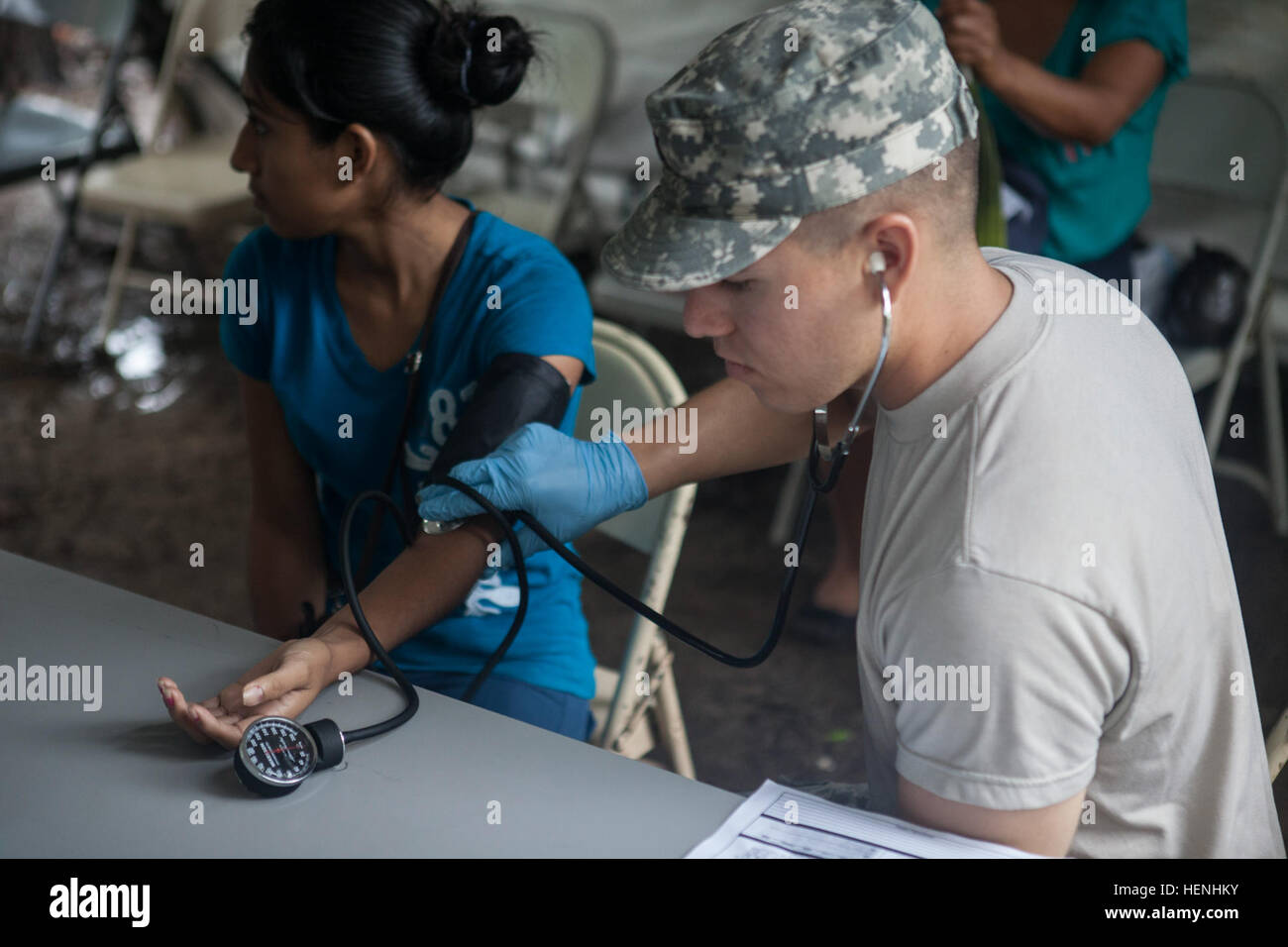 U.S. Army Spc. Steven Dixon, 349th Combat Support Hospital, conducts a medical exam at a Medical Readiness Training Exercise during Beyond the Horizon on June 2, 2014 in Rio Grande, Guatemala.  Beyond the Horizon is an annual exercise that embraces the partnership between the United States and Guatemala, to provide focused humanitarian assistance through various medical, dental, and civic action programs. (U.S. Army photo by Cpl. Michael Spandau/Released) Beyond The Horizon 2014, Guatemala 140602-A-TX665-005 Stock Photo
