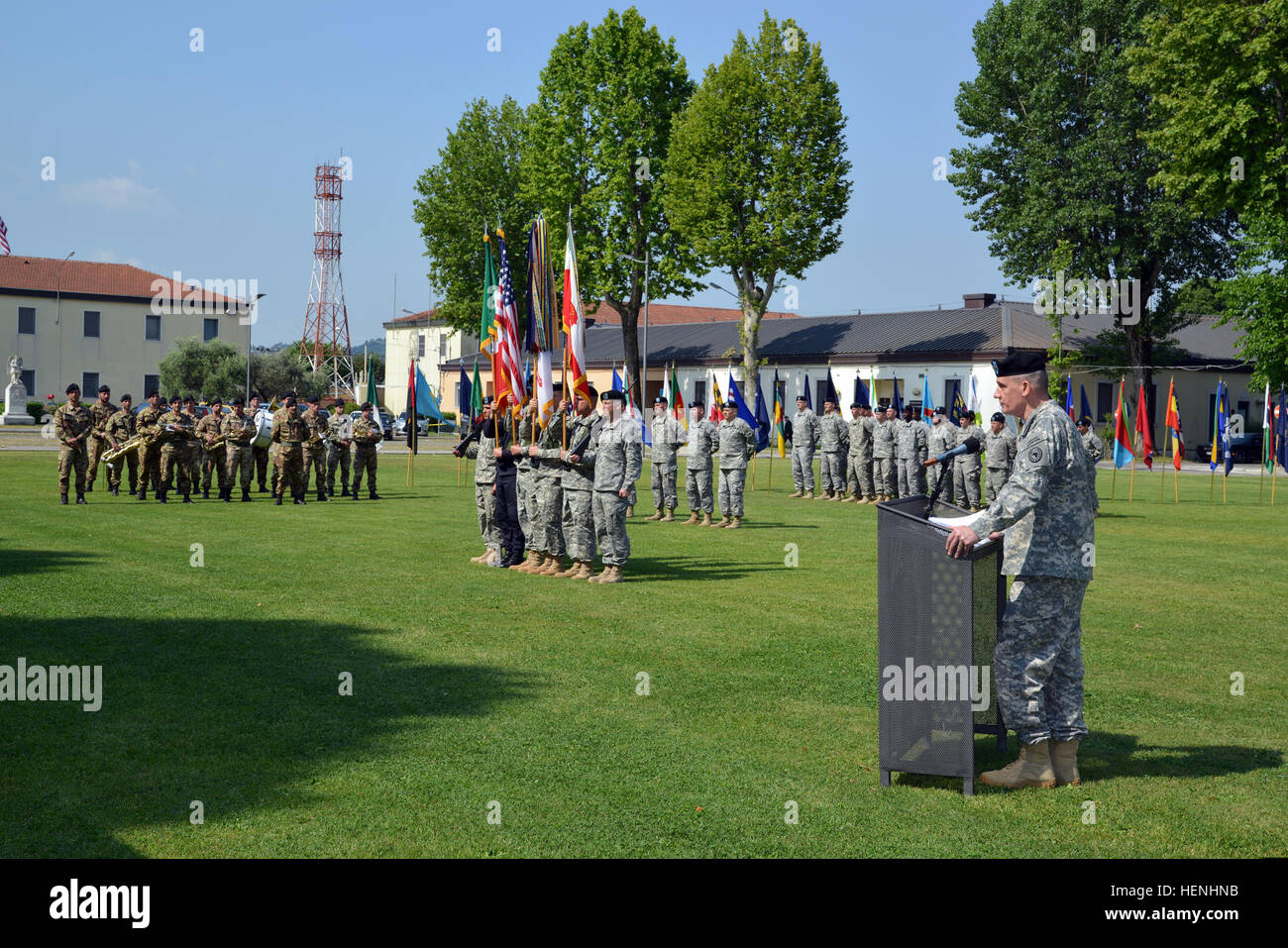 U.S. Army Gen. David M. Rodriguez, at the podium, the commanding general of U.S. Africa Command, addresses the audience during the change of command ceremony of U.S. Army Africa (USARAF)   on the grounds of Hoekstra Field, at Caserma Ederle, in Vicenza, Italy, June 3, 2014. Rodriguez presided over the ceremony, where Maj. Gen. Patrick J. Donahue II, the outgoing commander relinquished command of USARAF, Southern European Task Force to Maj. Gen. Darryl A. Williams. (U.S. Army photo by Paolo Bovo/Released) U.S. Army Gen. David M. Rodriguez, at the podium, the commanding general of U.S. Africa Co Stock Photo