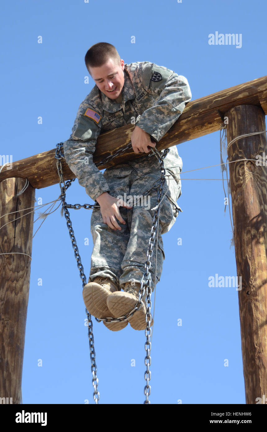 Army Pfc.  Corey Rose, Headquarters and Headquarters Battery, 32d Army Air and Missile Defense Command, scales an obstacles at a confidence course during the 32nd AAMDC's Blackjack Warrior Competition at Fort Bliss, Texas, June 5. The 32nd AAMDC conducts the Blackjack Warrior Competition each year to identify and recognize Soldiers, noncommissioned officers and officers throughout the command who possess exemplary qualities, warrior ethos, and tactical proficiency. (U.S. Army photo by Sgt. Kyle Wagoner, 32nd Army Air and Missile Defense Command) 32nd AAMDC hosts Blackjack Warrior Competition 1 Stock Photo