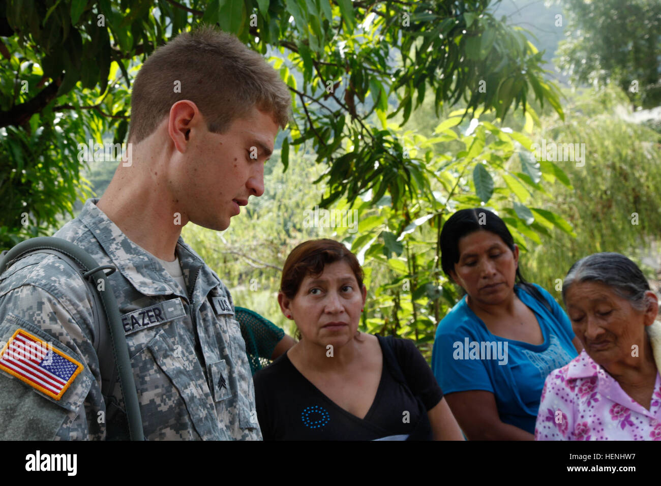 U.S. Army Sgt. Mitch Beazer with the 300th Military Intelligence speaks with a Guatemalan family about the quality of care they received at the Medical Readiness Training Exercise during Beyond the Horizon, at Rio Grande, Guatemala, on June 3 2014. Beyond the Horizon is an annual exercise that embraces the partnership between the United States and Guatemala, to provide focused humanitarian assistance through various medical, dental, and civic action programs. (U.S. Army photo by Pfc. Josue Mayorga/released) Beyond The Horizon 2014, Guatemala 140603-A-GK700-026 Stock Photo