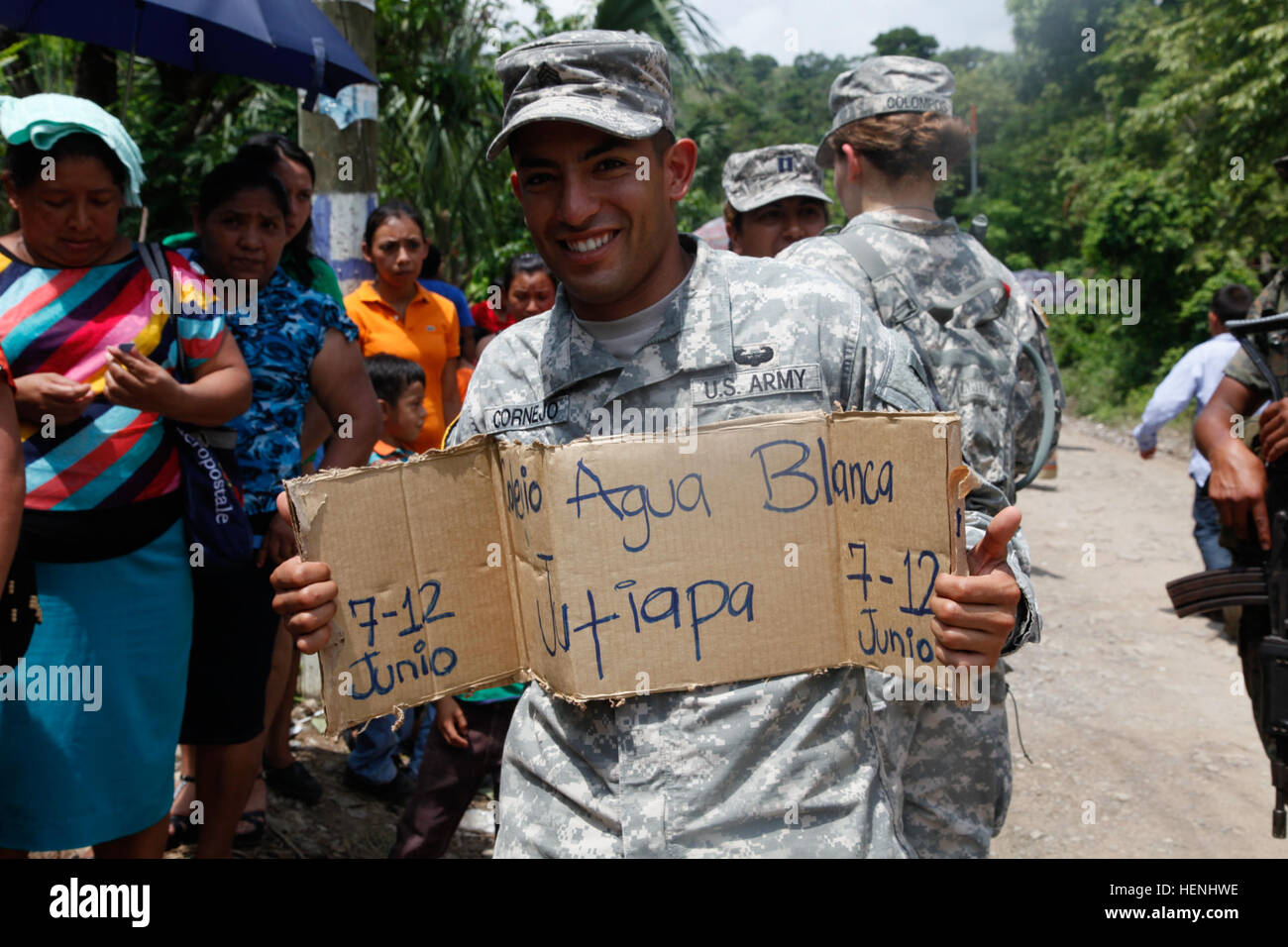 U.S. Army Sgt. Julian Cornejo with 349th Combat Support Hospital informs Guatemalan citizens of an upcoming Medical Readiness Training Exercise during Beyond the Horizon, at Rio Grande, Guatemala, on June 3, 2014. Beyond the Horizon is an annual exercise that embraces the partnership between the United States and Guatemala, to provide focused humanitarian assistance through various medical, dental, and civic action programs. (U.S. Army photo by Pfc. Josue Mayorga/released) Beyond The Horizon 2014, Guatemala 140603-A-GK700-086 Stock Photo