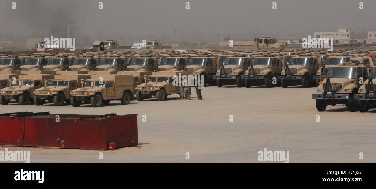 U.S. and Iraqi military service members inspect Humvees, 5-ton trucks and other logistical support equipment staged at the Old al Muthana vehicle warehouse in Baghdad, Iraq, March 26, 2008, prior to transfer to the Iraqi army. This equipment was procured by the Ministry of Defence through the foreign military sales program. (U.S. Army photo by Capt. David F. Roy/Released) Iraqi army vehicles and equipment 2008 Stock Photo