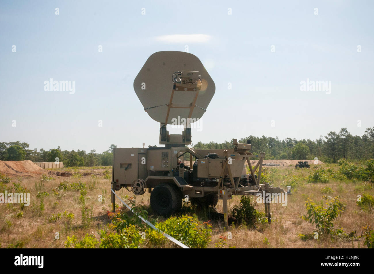 A satellite transportable terminal set up by the 558th Signal Company, from Maineville, Ohio sits behind the fuel farms during the 2014 Quartermaster Liquid Logistics Exercise (QLLEX), operationally controlled by 633rd Quartermaster Battalion, in Fort Bragg N.C., June 8 2014. (U.S. Army photo by Spc. Miguel Alvarez/Released) 2014 QLLEX 140608-A-DY471-001 Stock Photo