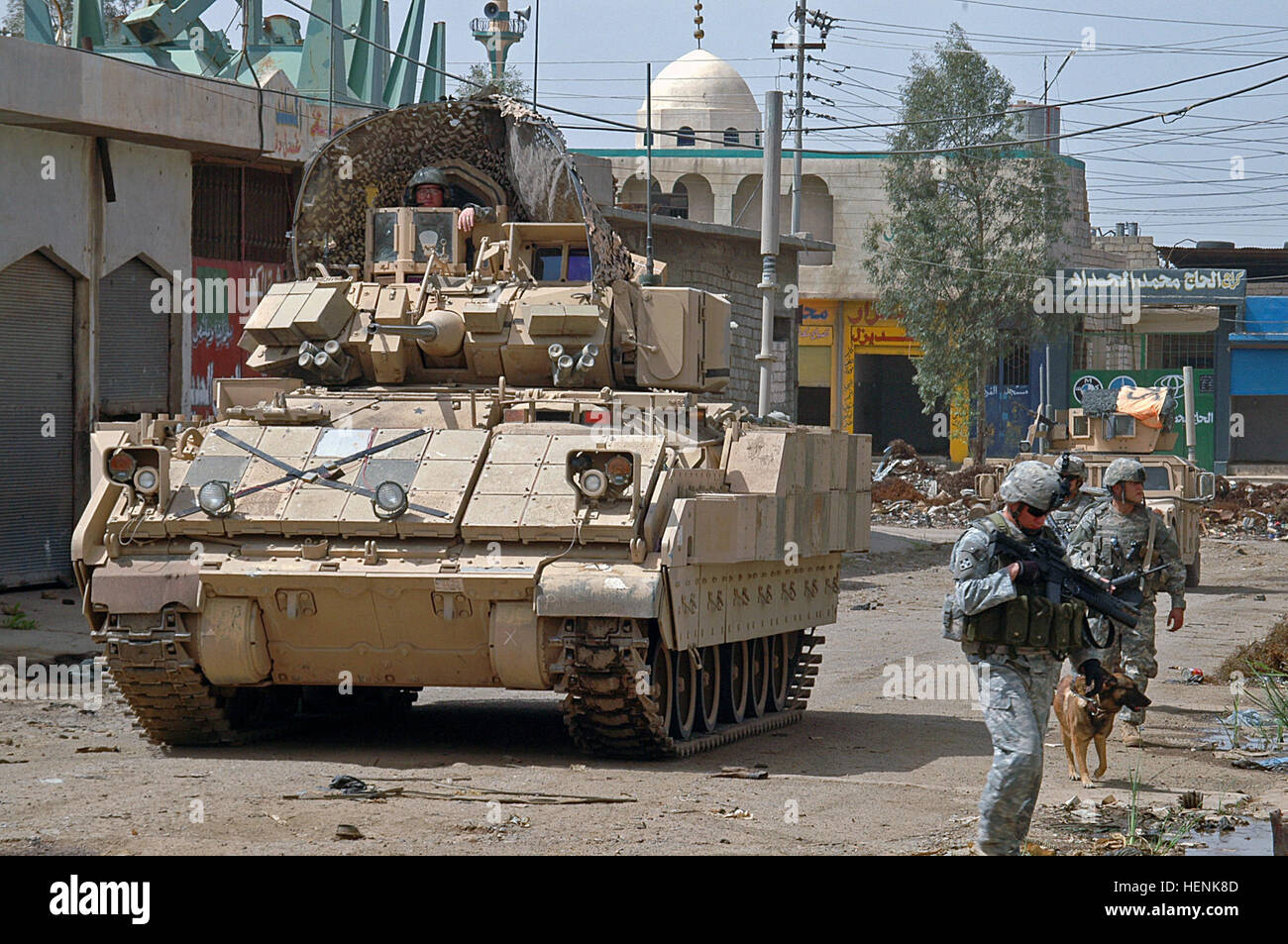 A Bradley Armored Personnel Carrier rolls down the streets of Mosul providing security for Soldiers of Co. D, 1st Battalion, 8th Infantry Regiment from Fort Carson, Colo., clearing the al-Sinaa neighborhood April 1. Bradleys provide security for Soldiers clearing Mosul 83290 Stock Photo