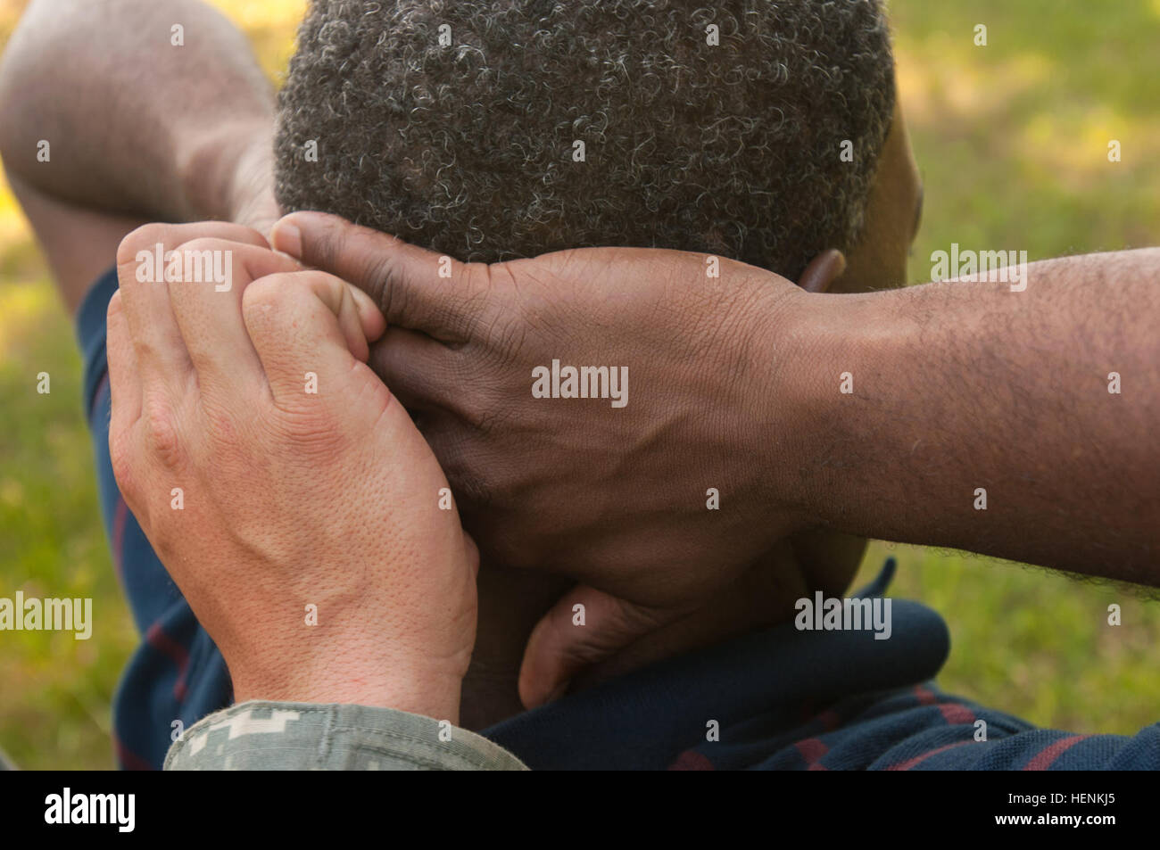 Spc. Ian P. Balag, an information management specialist with the U.S. Army Pacific Support Unit located at Fort Shafter, Hawaii, searches a detainee during an individual search and seizure event at the 2014 Army Reserve Best Warrior competition here. The competition pits Soldiers from each Army Reserve command against each other, testing their physical and mental knowledge, skills and abilities of Army Warrior Tasks. (U.S. Army photo by Staff Sgt. Rufus T. Stuckey) 2014 Army Reserve Best Warrior 140624-A-LY493-112 Stock Photo