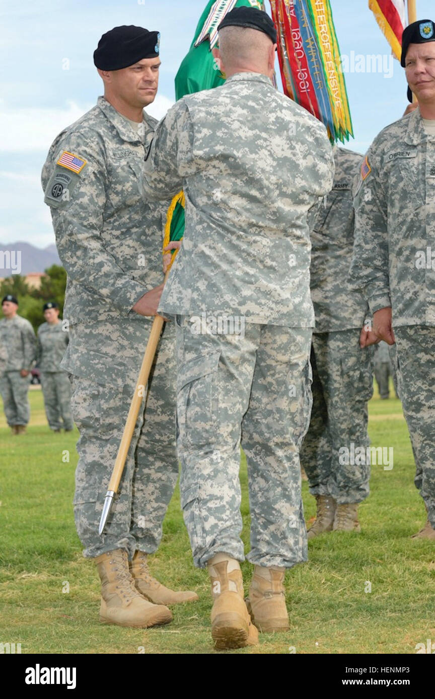 Reviewing officer for the 93rd Military Police Battalion's Change of Command and Change of Responsibilities ceremony, Col. Robert N. Dillon officially assigns the 93rd to incoming commander Lt. Col. Jeremy R. Wilingham, Fort Bliss, Texas, July 16. (U.S. Army photo by Sgt. James Avery) 93rd Military Police Battalion Change of Command and Change of Responsibility 140716-A-FJ979-170 Stock Photo