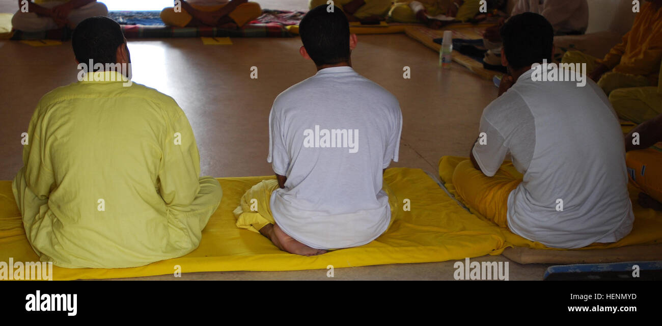 Detainees listen during a voluntary religious discussion class at the internment facility in Camp Bucca, Iraq. Camp Bucca Internment Facility 84881 Stock Photo