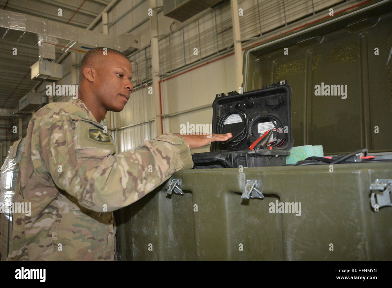 A U.S. Army Soldier conducts a customs inspection on robotics equipment ...