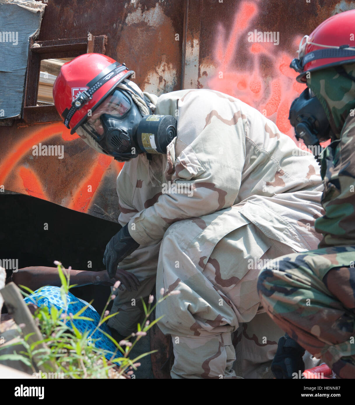 Soldiers of the 11th Engineer Battalion, Fort Benning, Ga., evacuate survivors of a nuclear blast, escorting them to a decontamination zone to receive medical treatment during Vibrant Response, a training exercise held at the Muscatatuck Urban Training Complex, Ind., July 24, 2014. Vibrant Response is a major field training exercise conducted by the U.S. Northern Command and led by U.S. Army North. Approximately 5,000 service members and civilians from the military and other federal and state agencies throughout the country are training to respond to a catastrophic domestic incident. As a comp Stock Photo