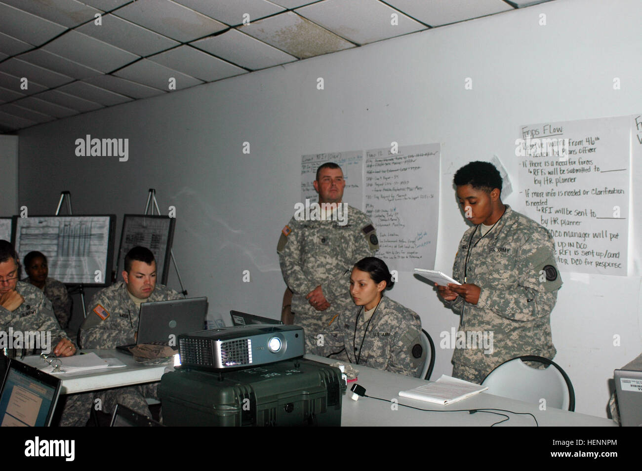 Task Force Operations Commander Col. Lee Ellis receives a brief from