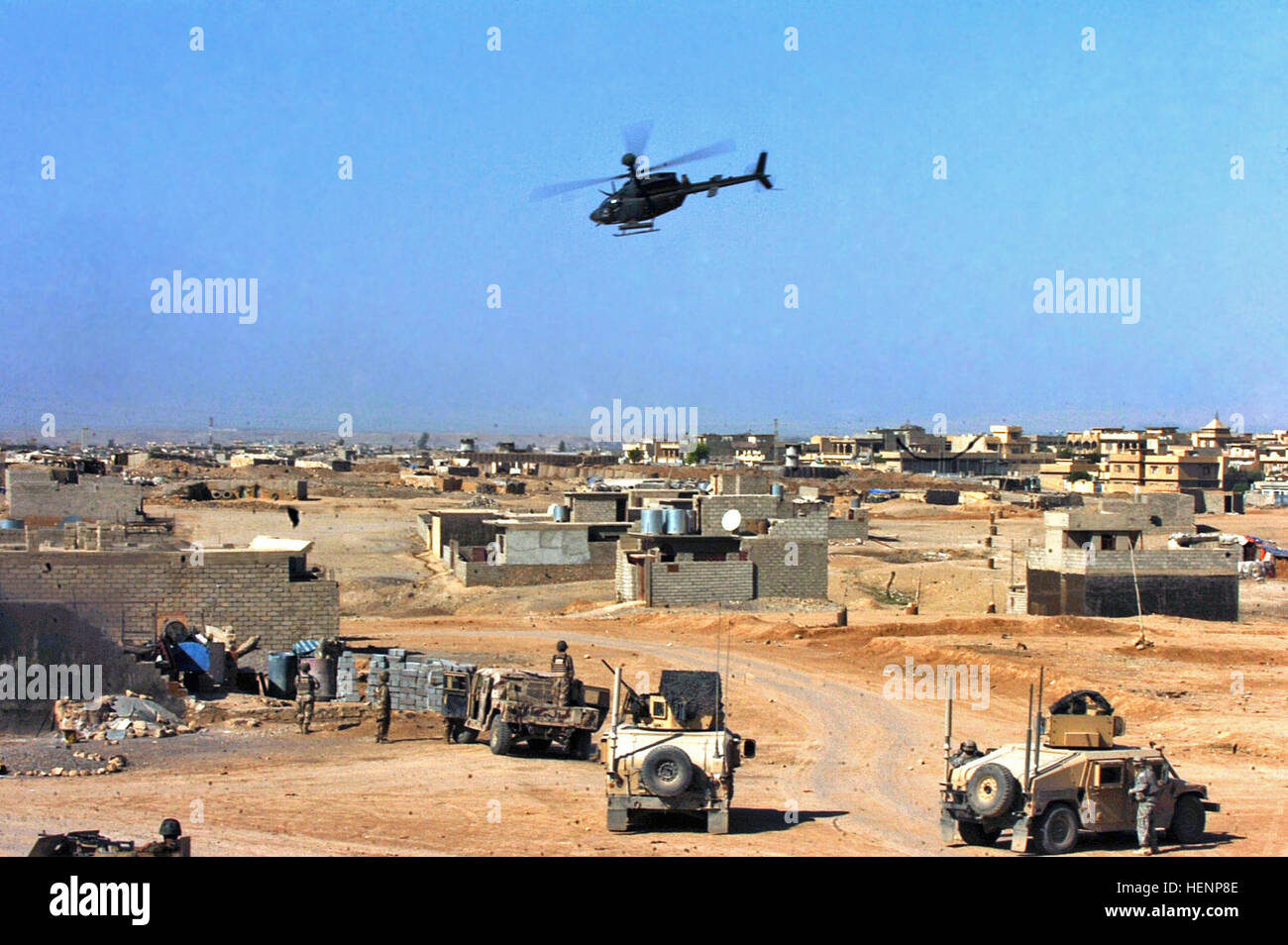 An OH-58 Kiowa helicopter moves in to support a joint Iraqi Army and Coalition Forces raid after small-arms fire is heard nearby in Mosul, Iraq, April 17. IA, CF raids on Mosul builds bonds between Armies 85260 Stock Photo