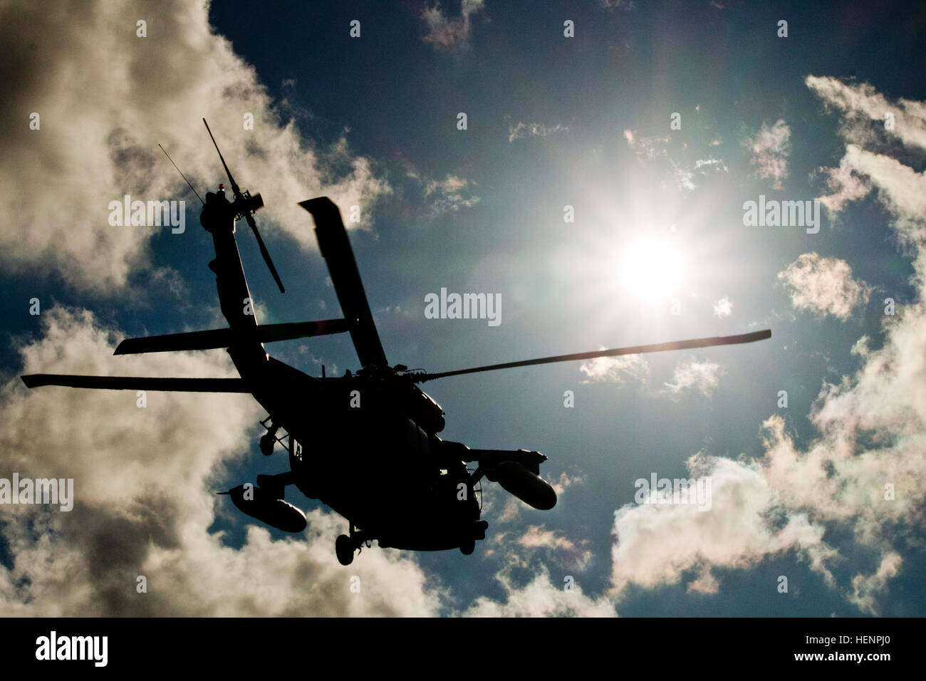 A UH-60 Black Hawk helicopter from 3rd Battalion, 158th Aviation Regiment, 12th Combat Aviation Brigade descends to a landing zone during an air assault Aug. 22 at Paldiski, Estonia. Several Black Hawks inserted American paratroopers from the 173rd Airborne Brigade and Estonian soldiers from the Estonian Defense Forces’ Single Scouts Infantry Battalion during this three-day training mission that featured day and night assaults. The training is part of Operation Atlantic Resolve, an exercise dedicated to demonstrating commitment to NATO obligations and maintaining interoperability with allied f Stock Photo