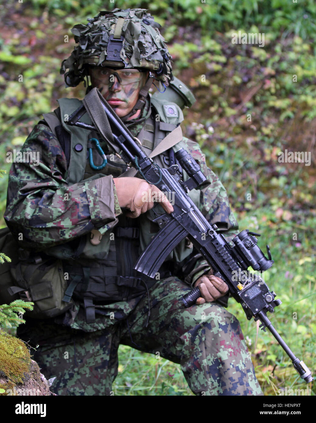 Estonian Land Force Cpl. Albert Benedik provides security during a