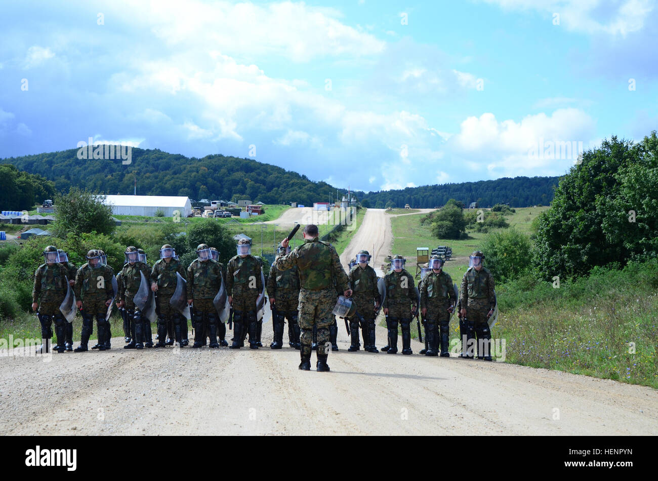 Bosnian-Herzegovinian soldiers receive a briefing on crowd riot control operations Aug. 27, 2014, during Saber Junction 2014 at the Joint Multinational Readiness Center in Hohenfels, Germany. Saber Junction is a U.S. Army Europe-led exercise designed to prepare U.S., NATO and international partner forces for unified land operations. (U.S. Army photo by Spc. Sara Hering/Released) Bosnian-Herzegovinian soldiers receive a briefing on crowd riot control operations Aug. 27, 2014, during Saber Junction 2014 at the Joint Multinational Readiness Center in Hohenfels, Germany 140827-A-AO952-006 Stock Photo