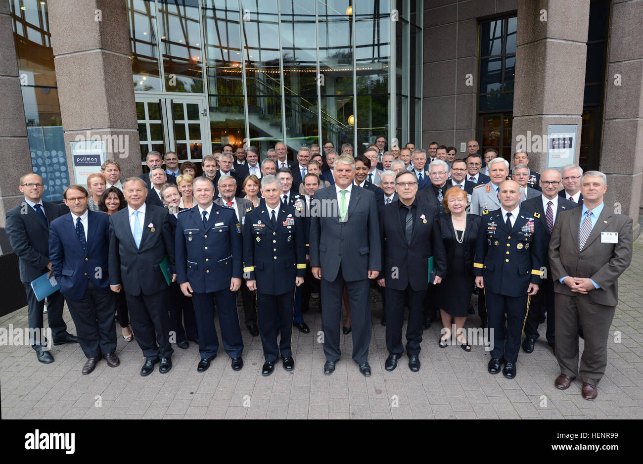 U.S. and German partners pose for a group photograph during the United States and Germany consultation meeting in Vaihingen, Germany, Sept. 3, 2014. (U.S. Army photo by Adam Sanders/Released) U.S. and German partners pose for a group photograph during the United States and Germany consultation meeting in Vaihingen, Germany, Sept. 3, 2014 140904-A-RU412-028 Stock Photo