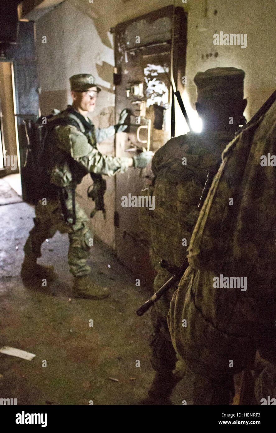 Army Pvt. Dustin M. Stechschulte, a Lima, Ohio, native serving as an infantryman in Company B, 2nd Battalion, 503rd Infantry Regiment, 173rd Airborne Brigade leads his team in breaching a cell inside an abandoned Soviet era prison during a rehearsal for a night raid mission held Sept. 5 at Rummu, Estonia. The raid was part of Steadfast Javelin II, a NATO exercise involving more than 2,000 troops from nine nations conducting various training missions across Estonia, Germany, Latvia, Lithuania and Poland. The exercise focuses on increasing interoperability and synchronizing complex operations be Stock Photo