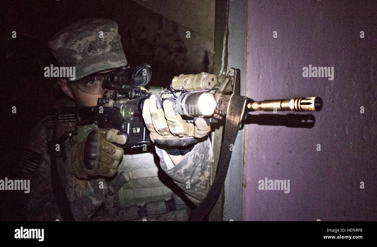 Army Sgt. Shawn M. Simmerman, a Brighton, Colo., native serving as a fire team leader in Company B, 2nd Battalion, 503rd Infantry Regiment,173rd Airborne Brigade clears a room inside Murru Vanglad, an abandoned Soviet era prison, during a rehearsal for a night raid training mission held Sept. 5 in Rummu, Estonia. The raid was part of Steadfast Javelin II, a NATO exercise involving more than 2,000 troops from nine nations conducting various training missions across Estonia, Germany, Latvia, Lithuania and Poland. The exercise focuses on increasing interoperability and synchronizing complex opera Stock Photo