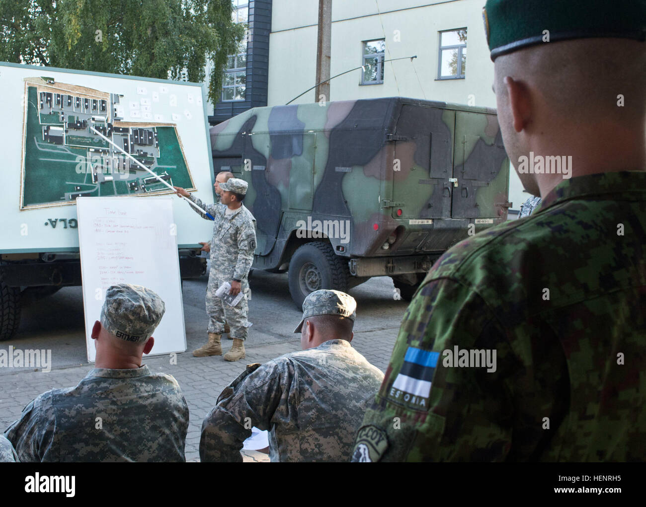Estonian soldiers from the Single Infantry Scouts Battalion and American paratroopers from the 173rd Airborne Brigade conduct a brief in preparation for a night raid training mission held Sept. 6-7 at Rummu, Estonia. The raid was part of Steadfast Javelin II, a NATO exercise involving more than 2,000 troops from nine nations conducting various training missions across Estonia, Germany, Latvia, Lithuania and Poland. The exercise focuses on increasing interoperability and synchronizing complex operations between allied air and ground forces through airborne and air assault missions. Free to figh Stock Photo