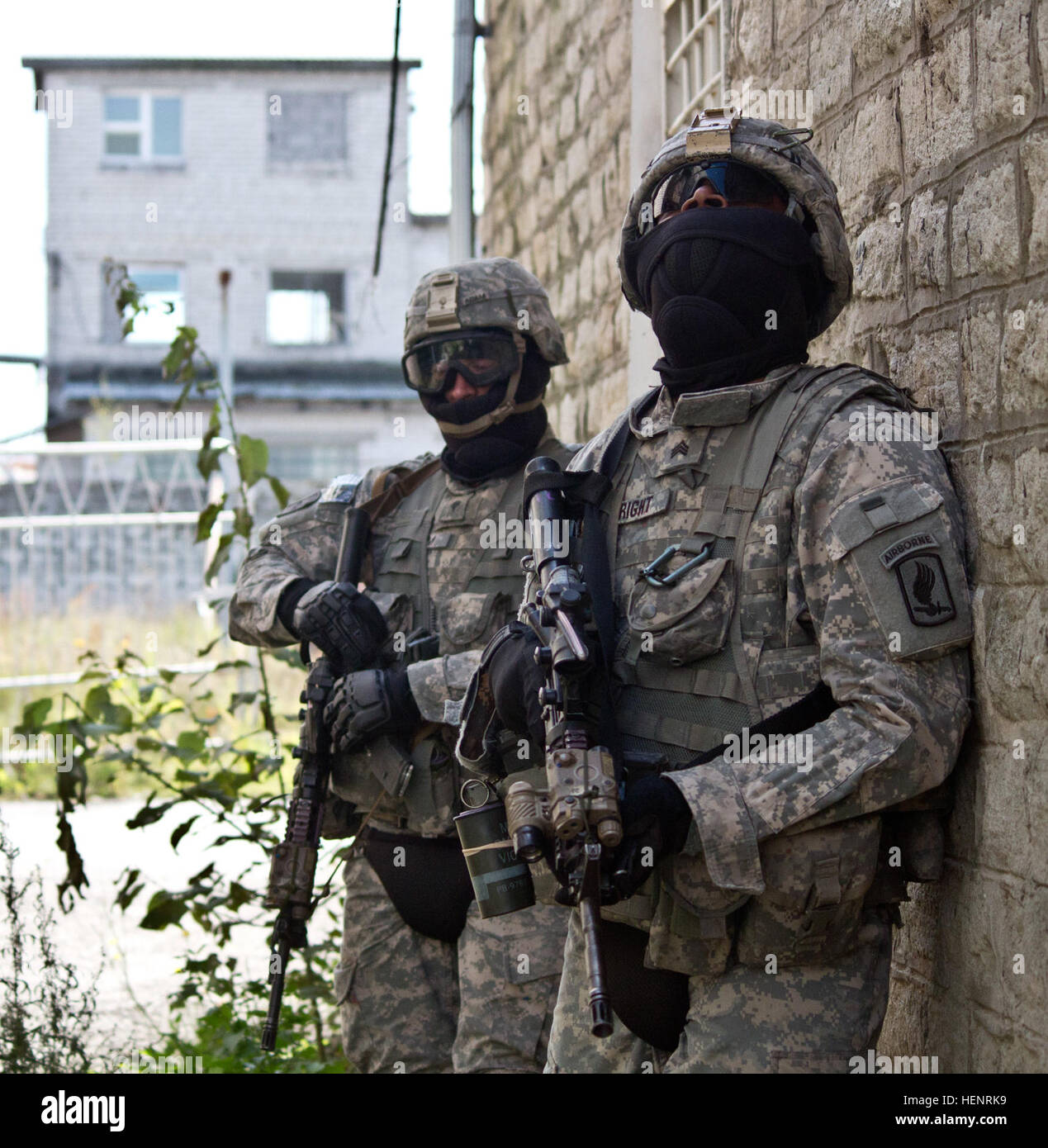 Army Sgt. Spencer B. Wright (right), a Merritt Island, Fla., native serving as an infantryman in Company B, 2nd Battalion, 503rd Infantry Regiment,173rd Airborne Brigade searches for Soldiers role-playing as insurgents at Murru Vanglad, an abandoned Soviet era prison, during a rehearsal for a night raid training mission held Sept. 7 at Rummu, Estonia. The raid was part of Steadfast Javelin II, a NATO exercise involving more than 2,000 troops from nine nations conducting various training missions across Estonia, Germany, Latvia, Lithuania and Poland. The exercise focuses on increasing interoper Stock Photo